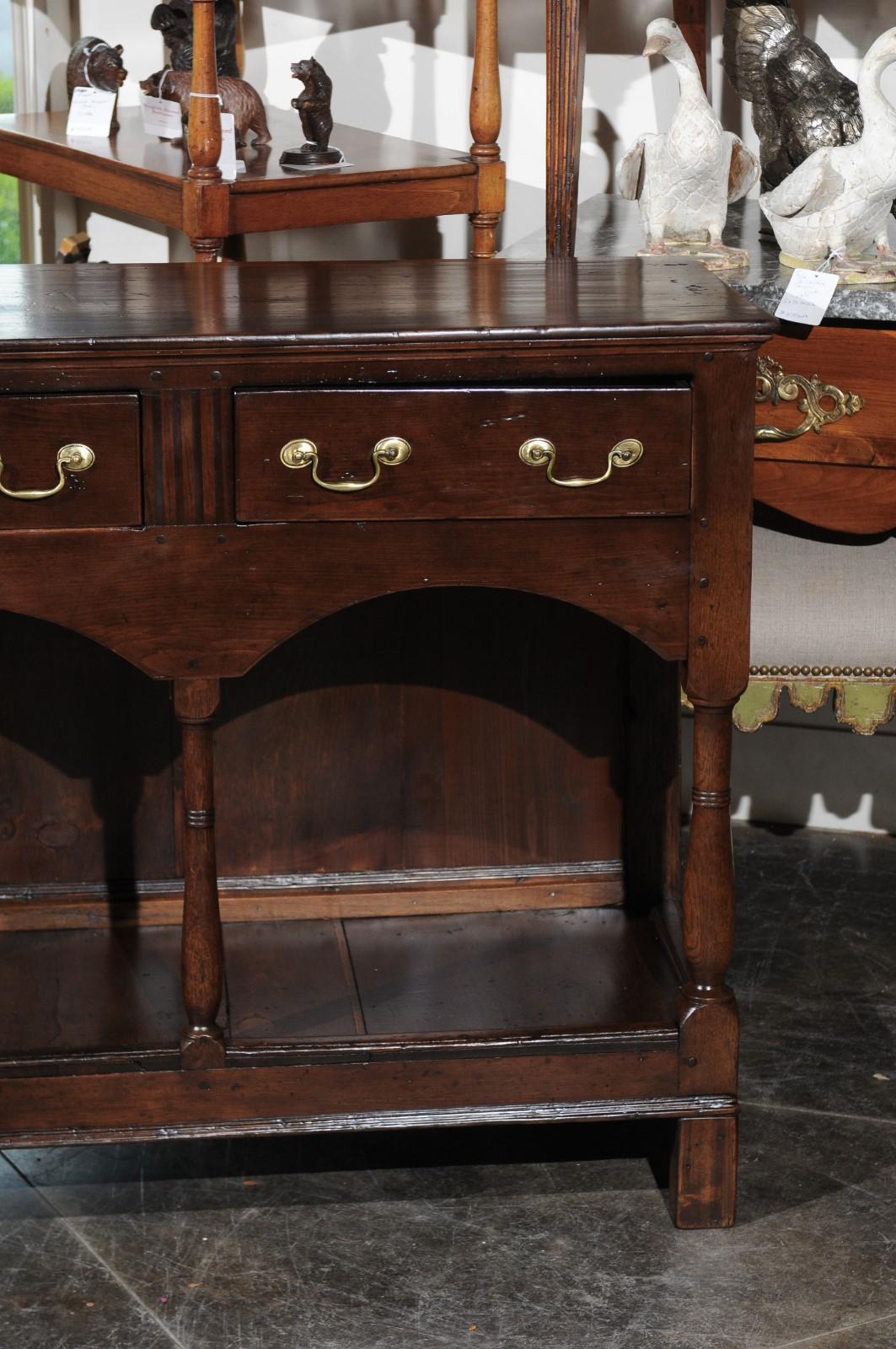 English 1820s Georgian Walnut Dresser Base with Balusters and Arched Apron 1