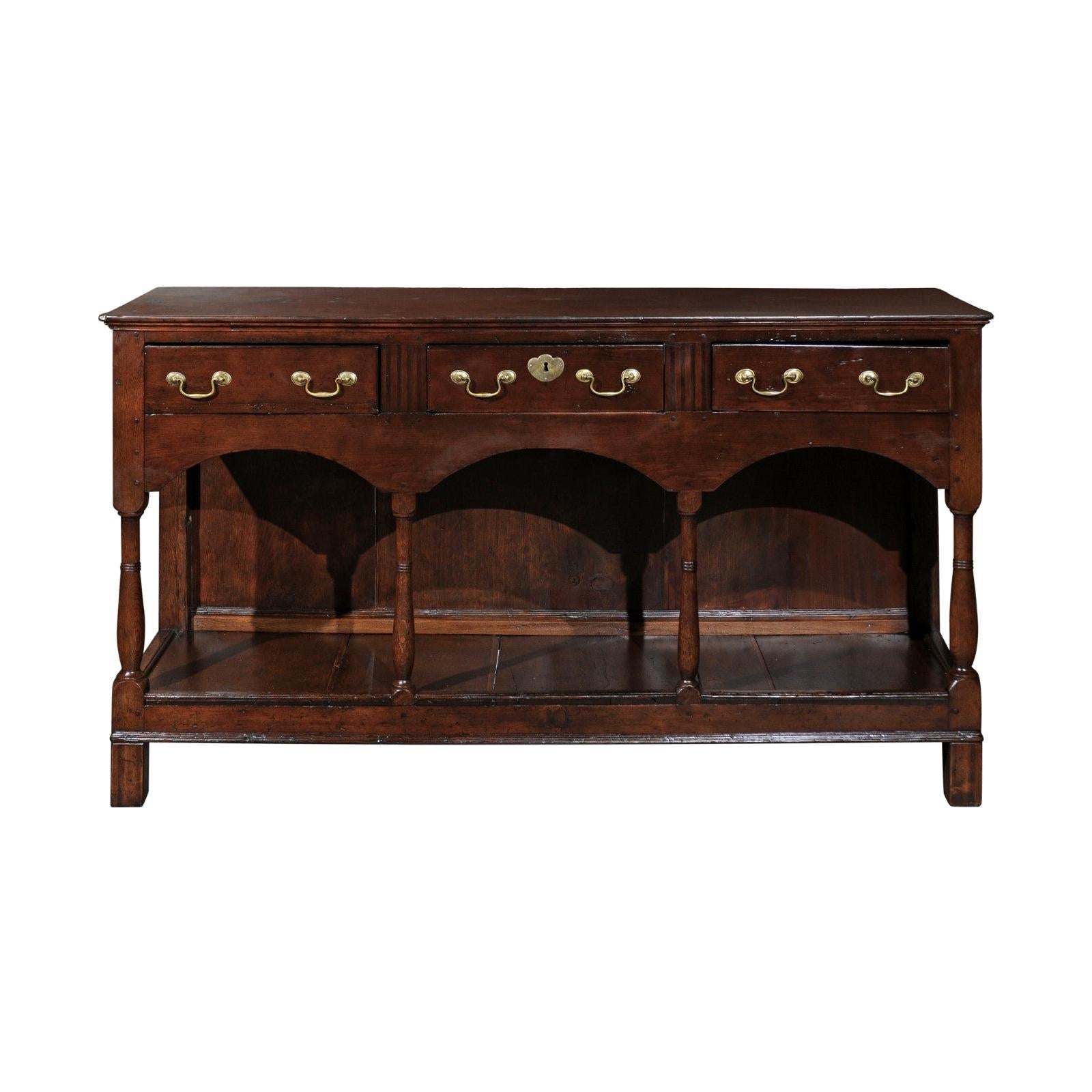 English 1820s Georgian Walnut Dresser Base with Balusters and Arched Apron