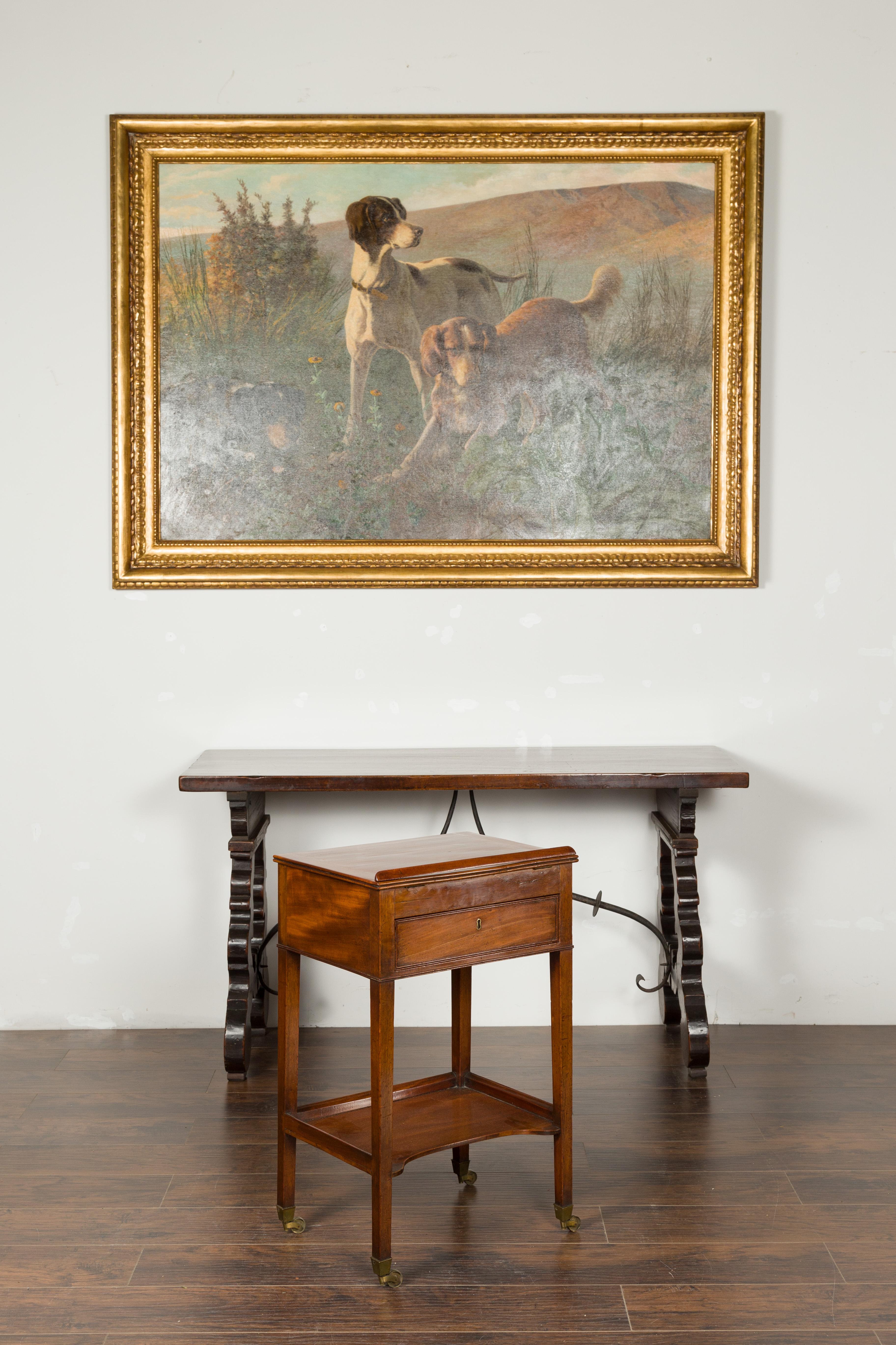 An English mahogany architect's table from the early 19th century, with tilt top, single drawer and shelf. Created in England during the first quarter of the 19th century, this mahogany architect's table features a rectangular top that lifts up,