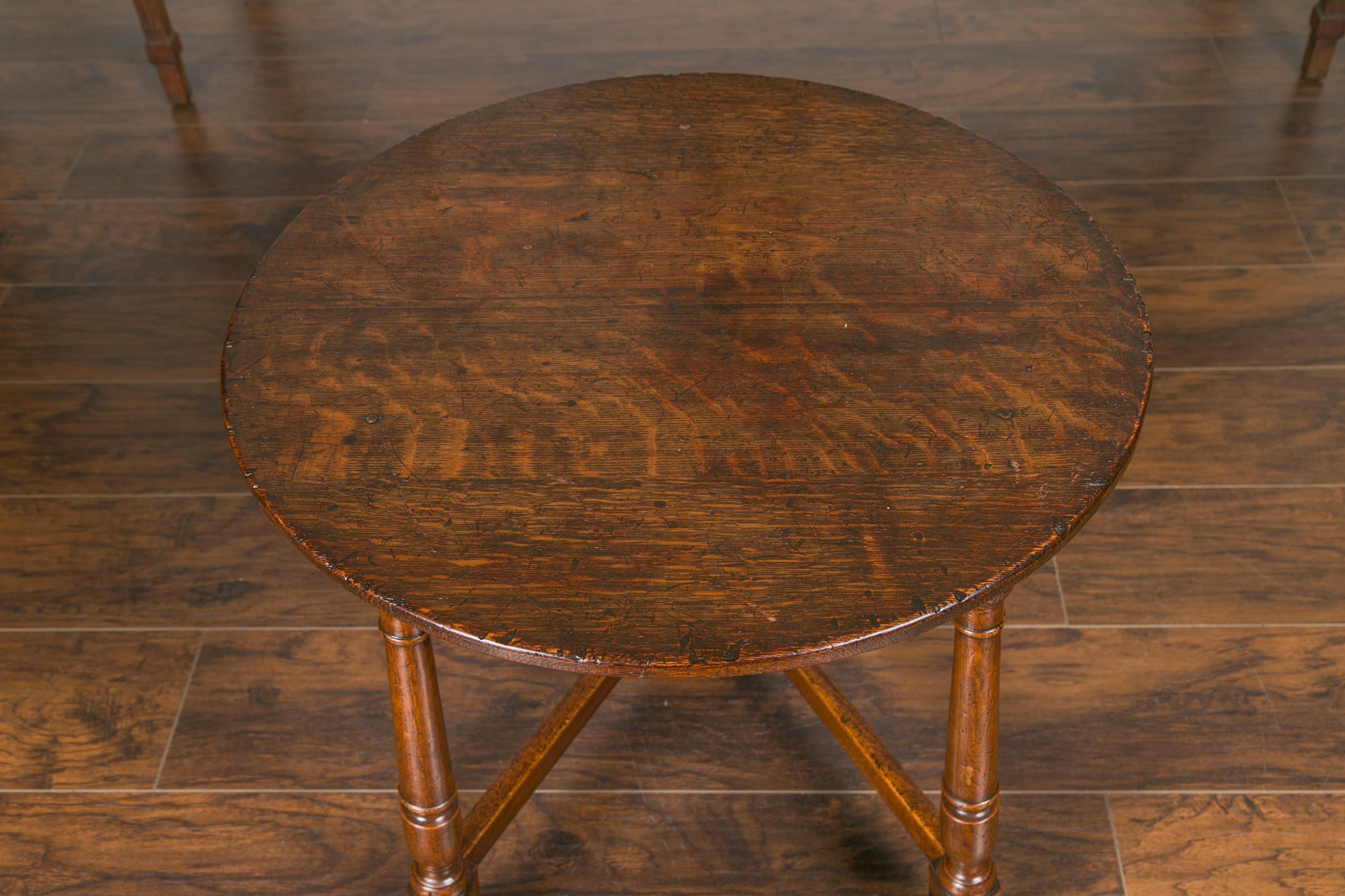19th Century English 1840s Oak Cricket Table with Circular Top, Turned Legs and Stretchers