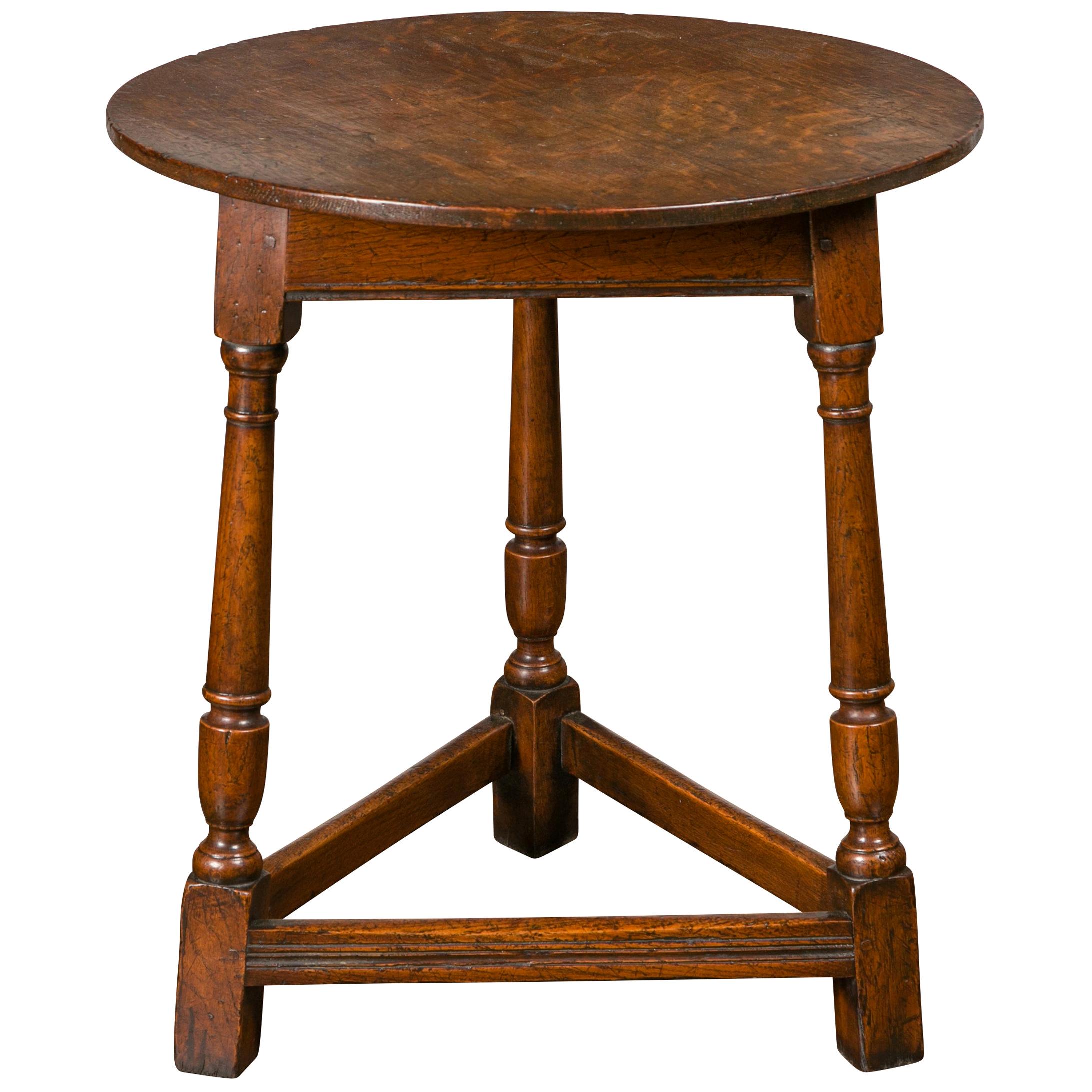 English 1840s Oak Cricket Table with Circular Top, Turned Legs and Stretchers