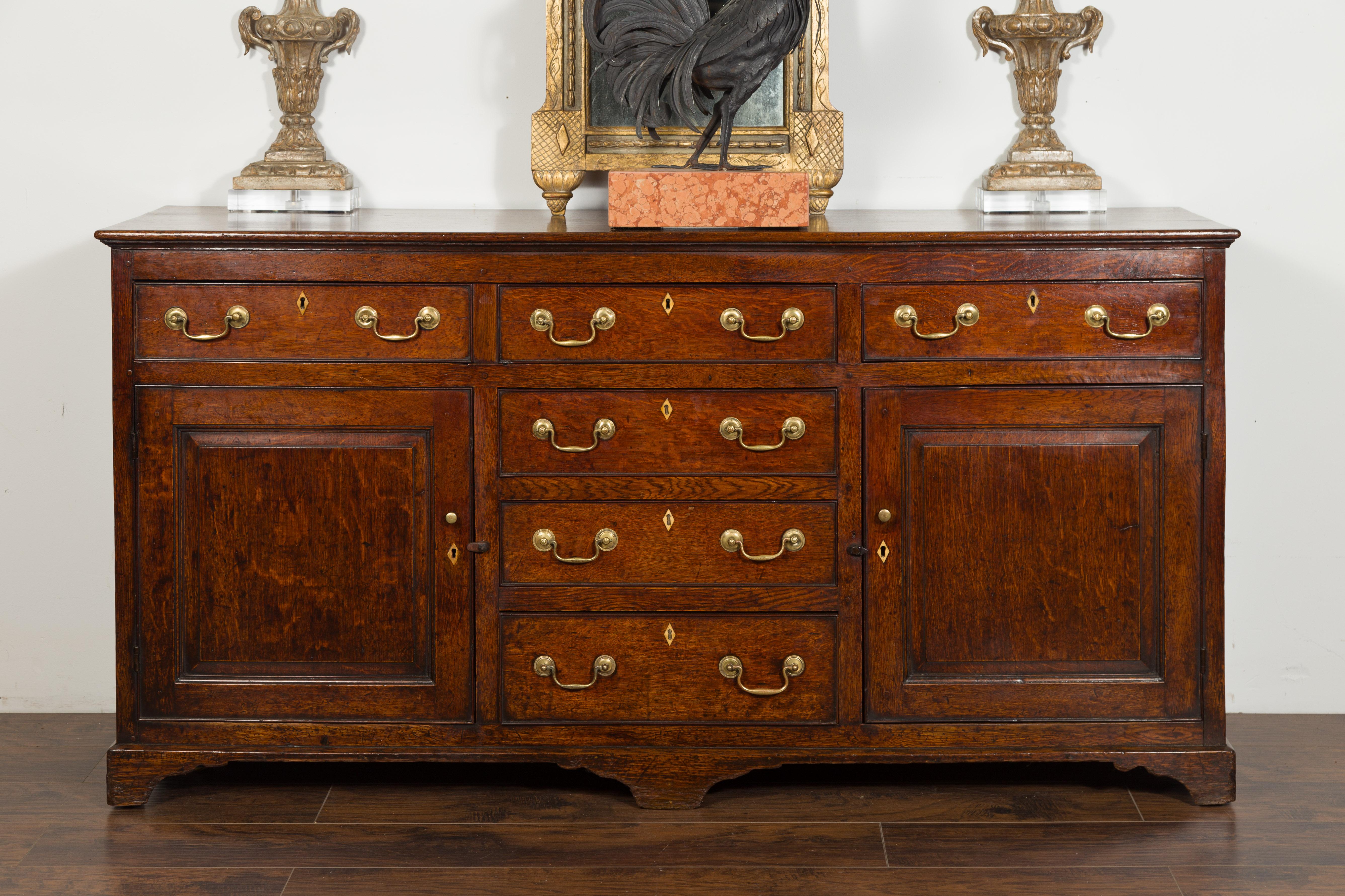 English 1850s Oak Dresser Base with Drawers, Doors, Brass Hardware, Bone Inlay In Good Condition In Atlanta, GA