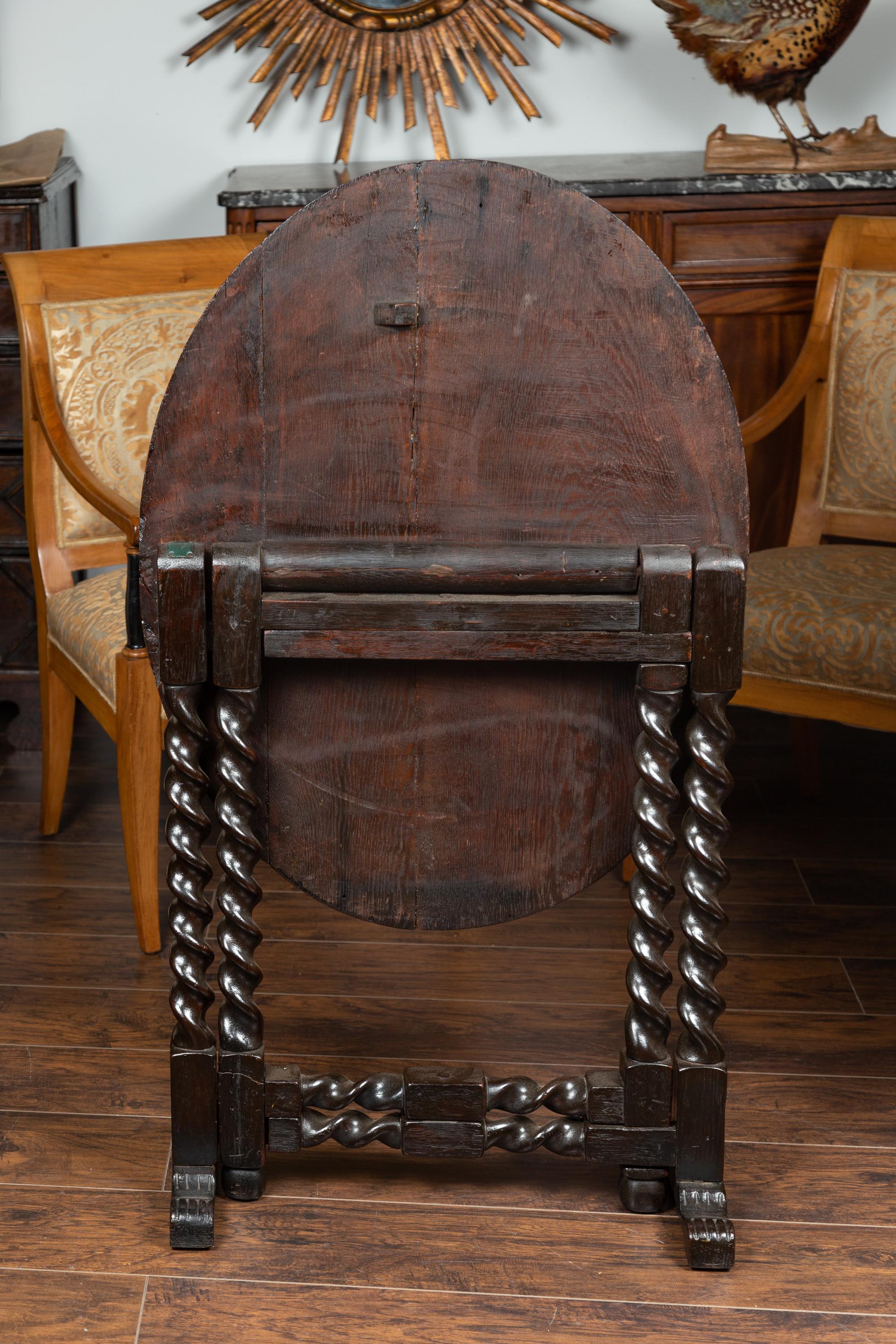 English 1850s Oak Gate Leg Oval Table with Carved Decor and Barley Twist Base For Sale 11