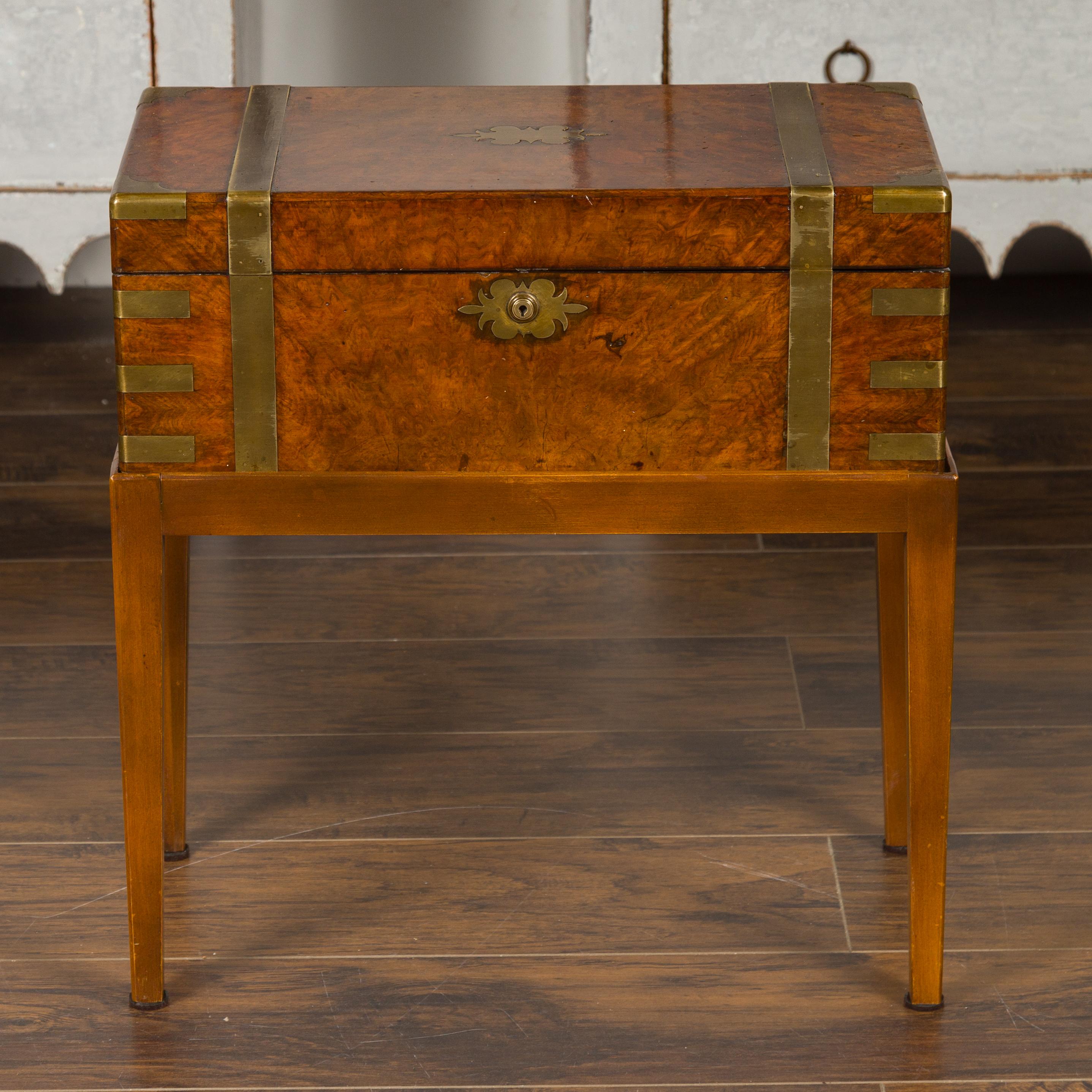 An English walnut lap desk from the mid-19th century with custom made stand and green leather inset. Born in England during the 1850s, this English box on Stand features a rectangular Campaign desk sitting above a custom made base. The brass bound