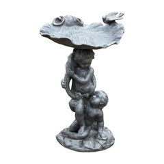 Estatua inglesa de 1860 con forma de querubín de plomo y concha de mar de aluminio