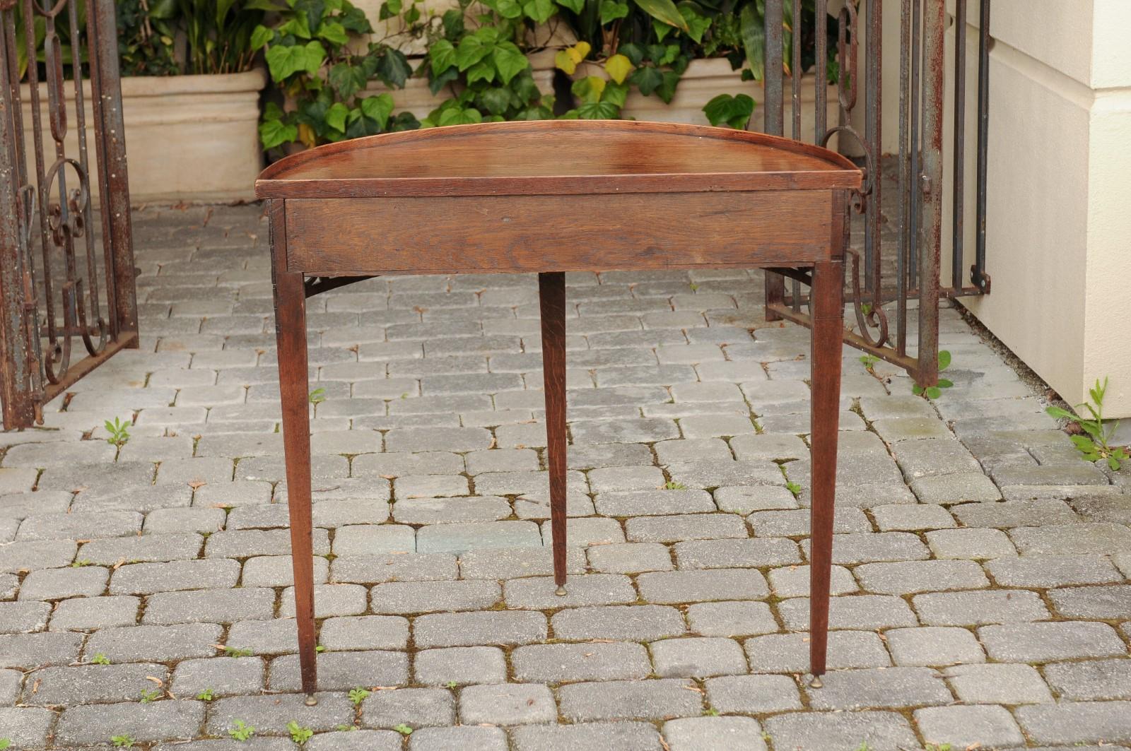 19th Century English 1860s Oak Demilune Table with Drawer, Tapered Legs and Pierced Motifs For Sale