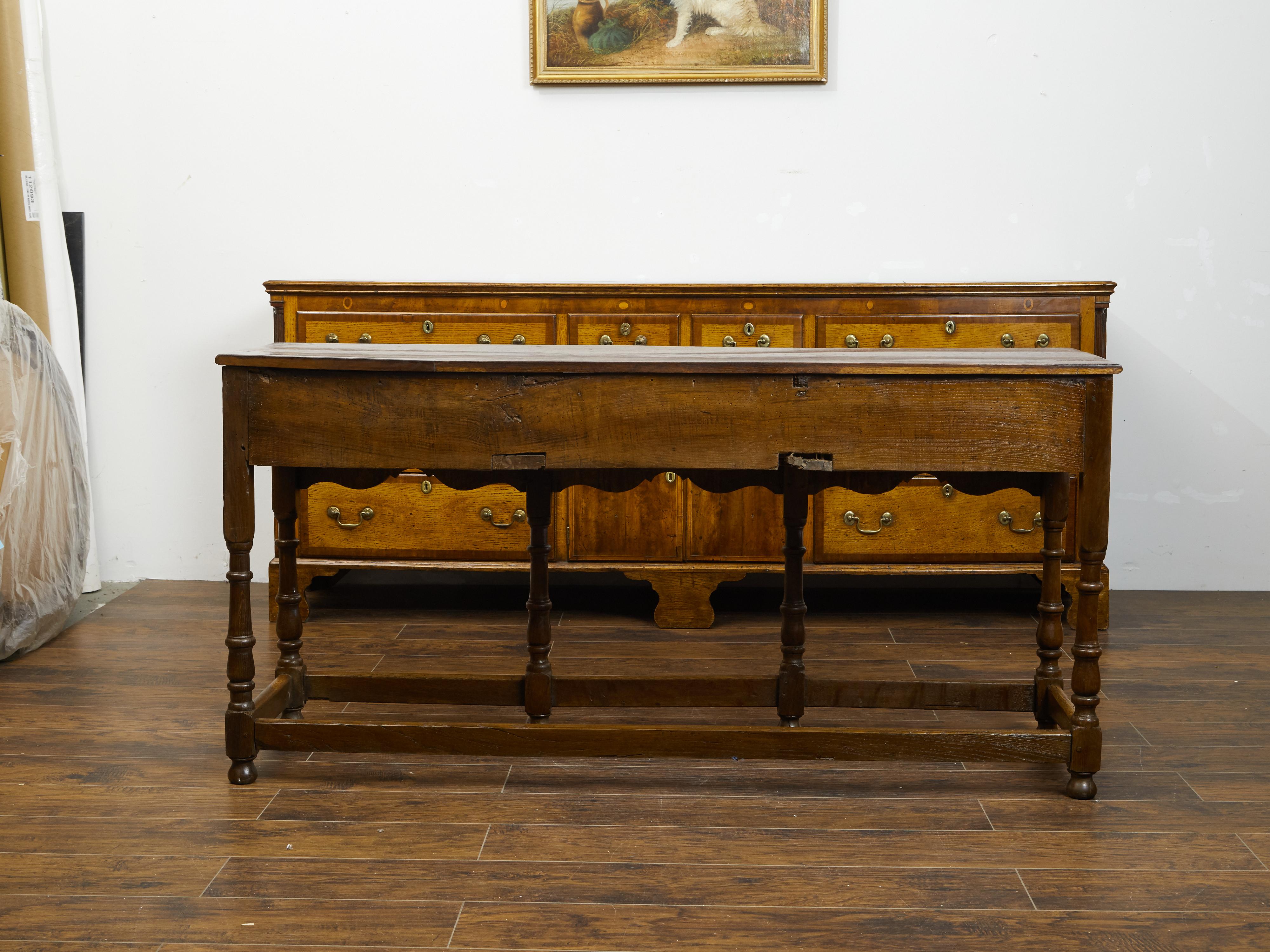 English 1860s Oak Dresser Base with Drawers, Scalloped Apron and Turned Legs For Sale 1