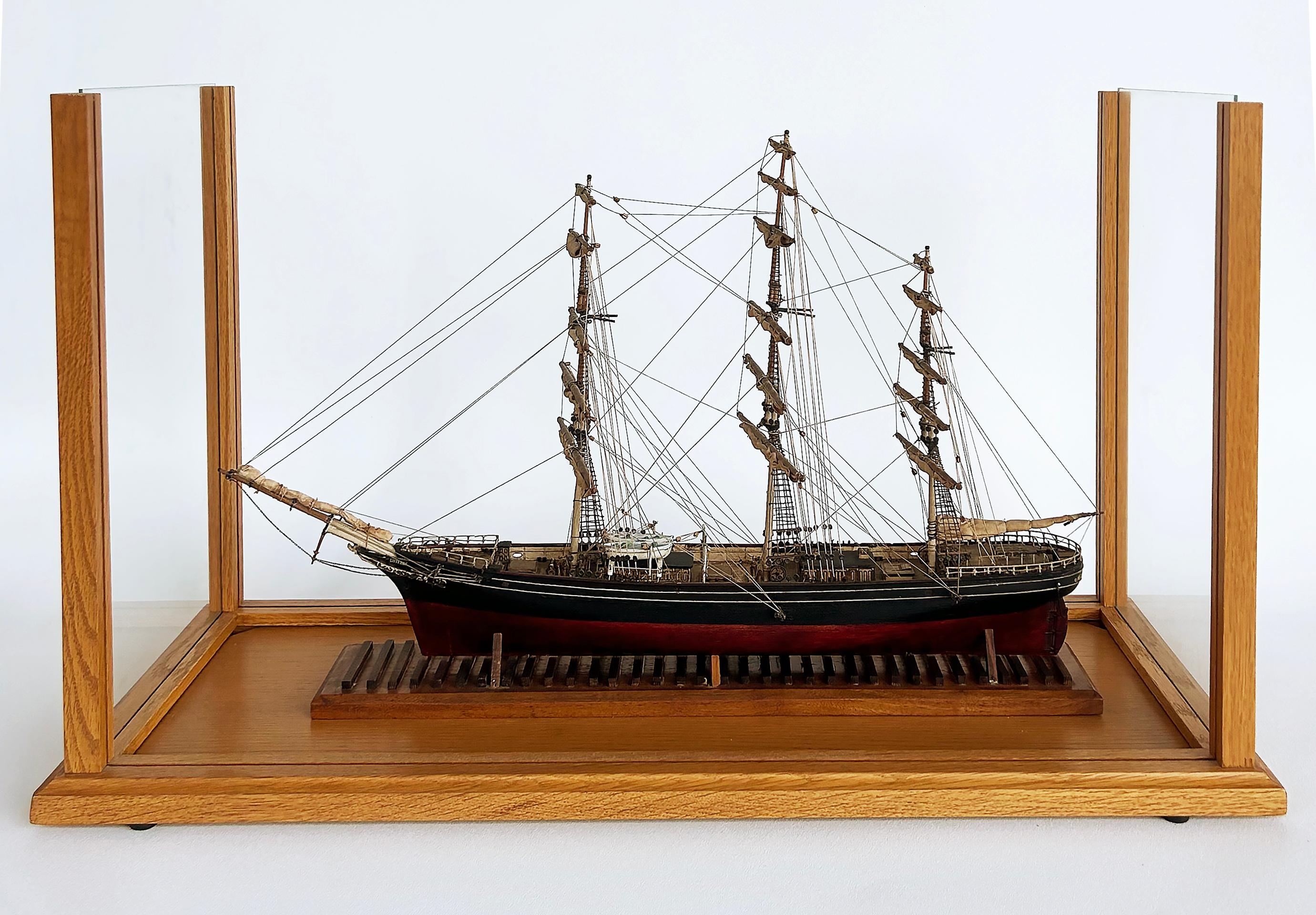 English 1870 Cutty Sark Clipper Hand-Crafted Model Encased in Wood, Glass 1970s

Offered for sale is a hand-crafted model of the 1870 English clipper ship the Cutty Sark which is encased in glass.  This finely crafted and detailed model dates to the