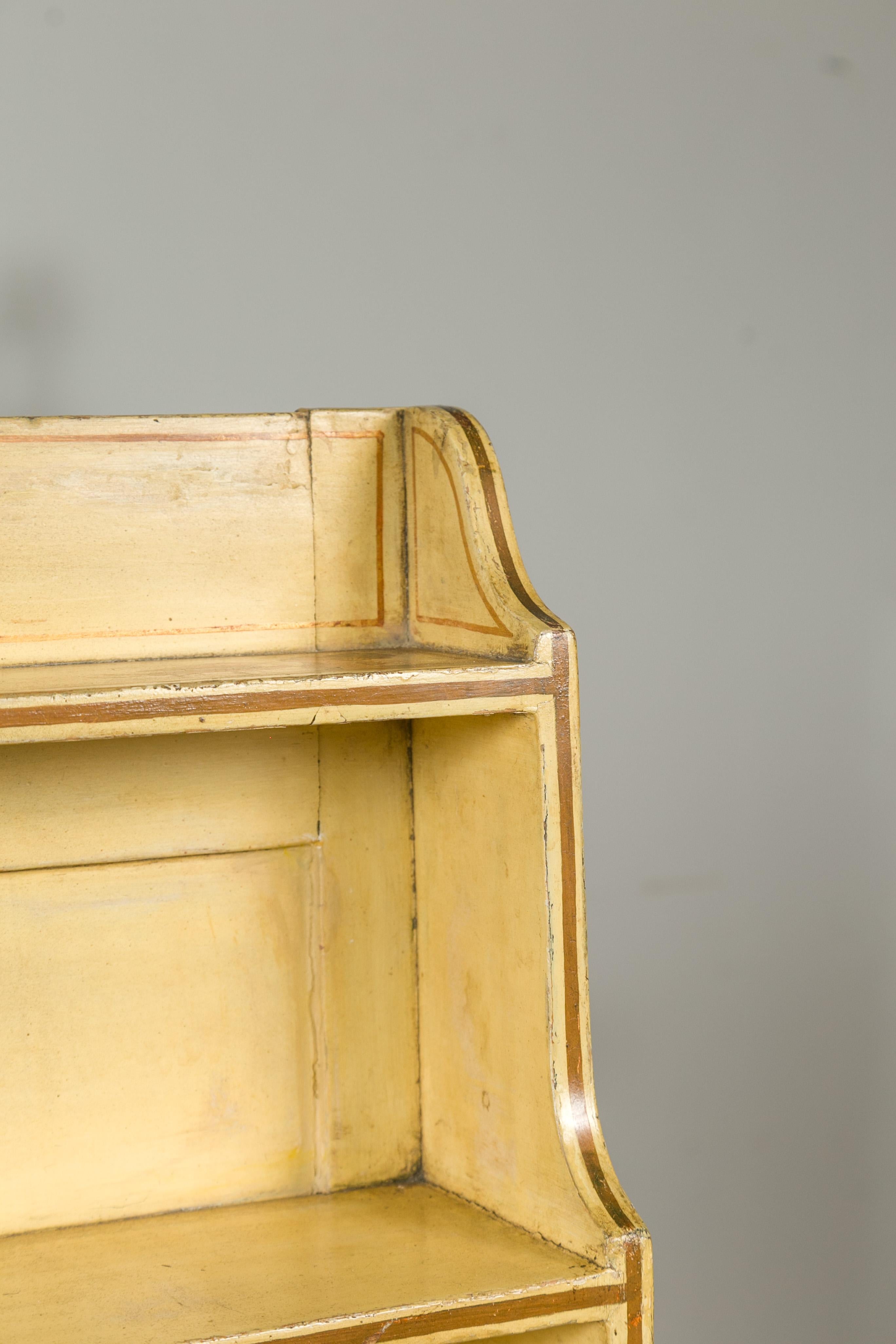 XIX secolo English 1870s Chinoiserie Waterfall Bookcase with Soft Yellow Painted Finish in vendita