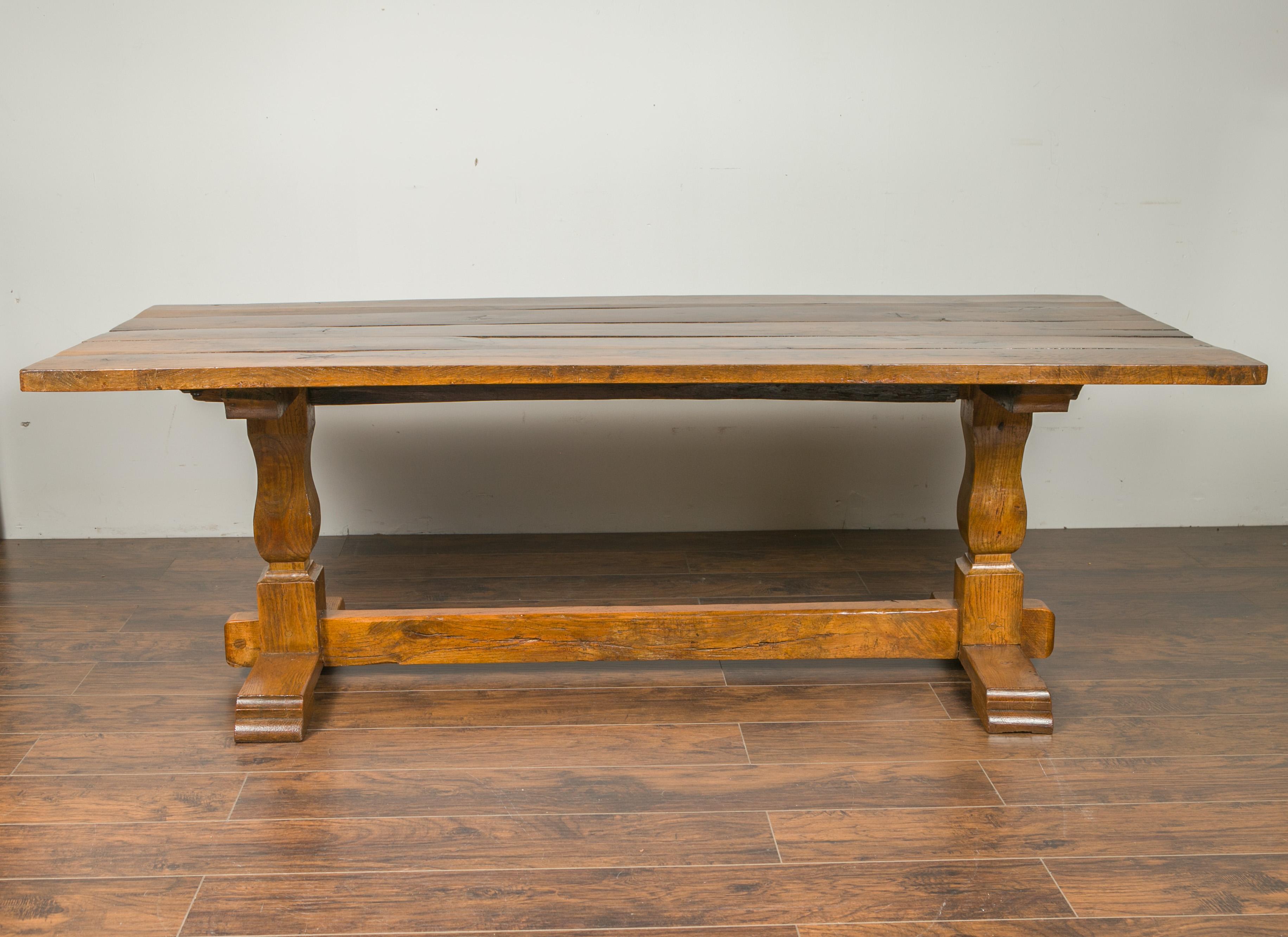 English 1870s Elm and Walnut Farm Table with Trestle Base and Baluster Legs 1