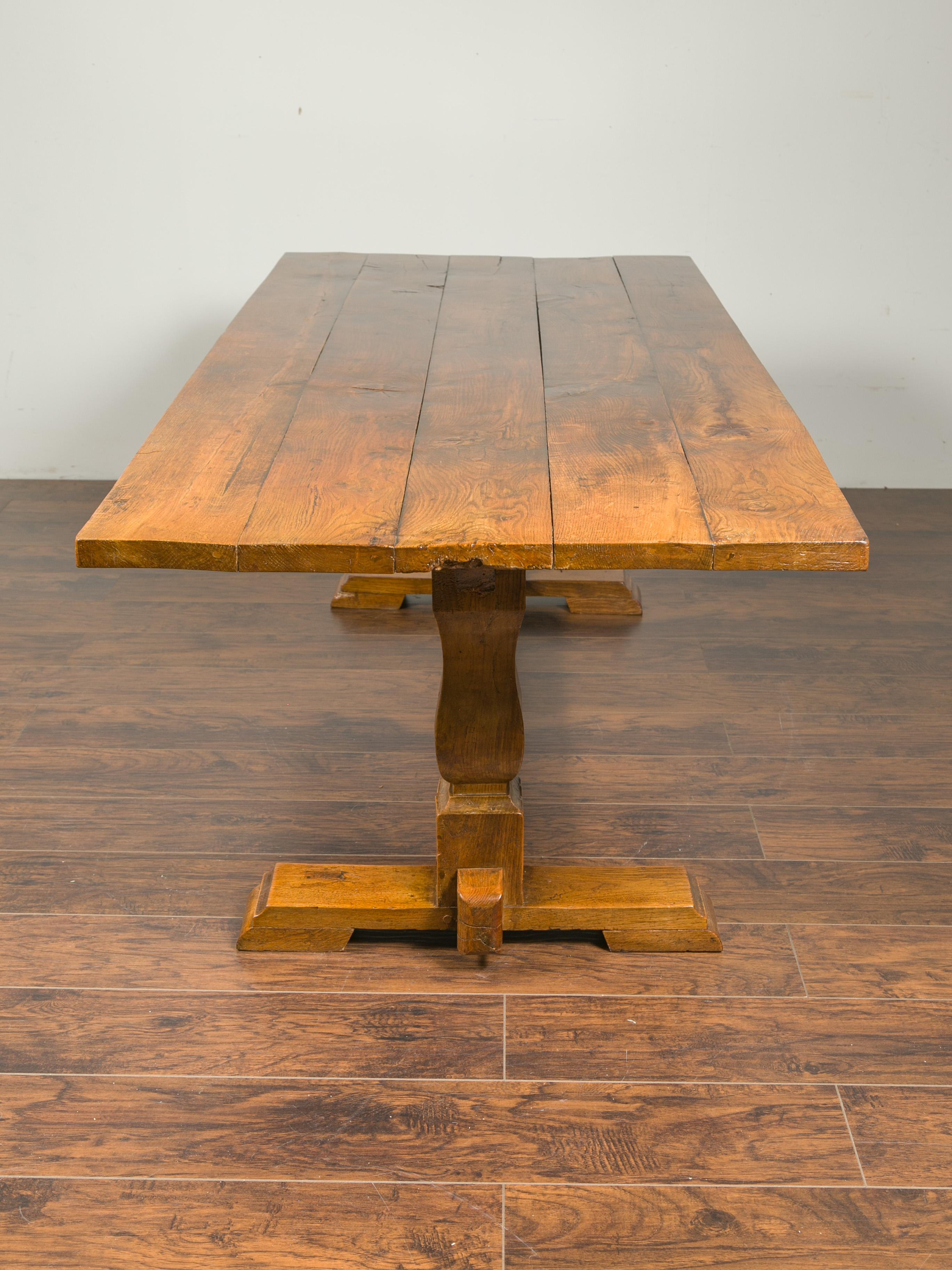 English 1870s Elm and Walnut Farm Table with Trestle Base and Baluster Legs 2