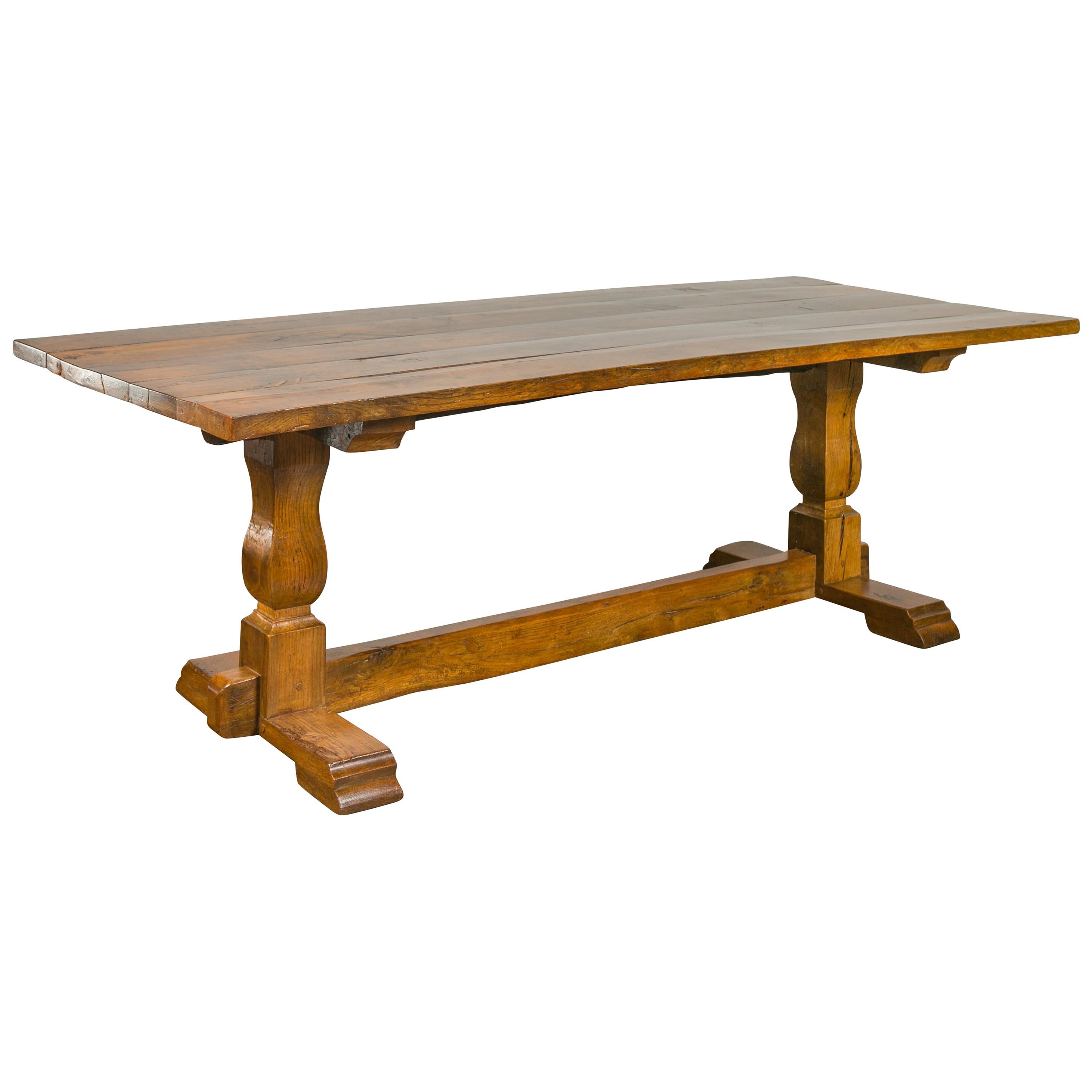 English 1870s Elm and Walnut Farm Table with Trestle Base and Baluster Legs