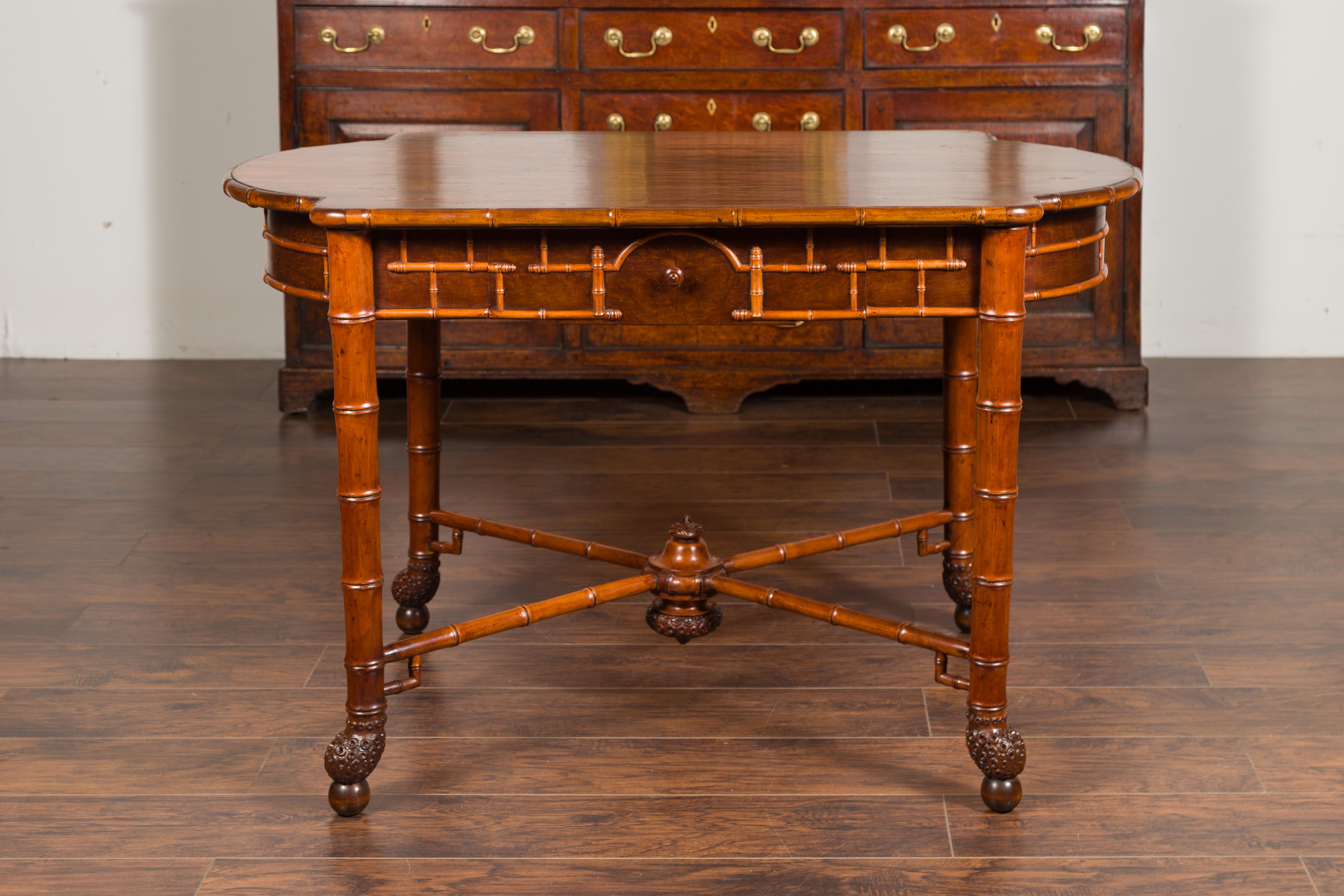 19th Century English 1870s Faux Bamboo Walnut Desk with Oval Top, Drawers and Root Style Feet For Sale