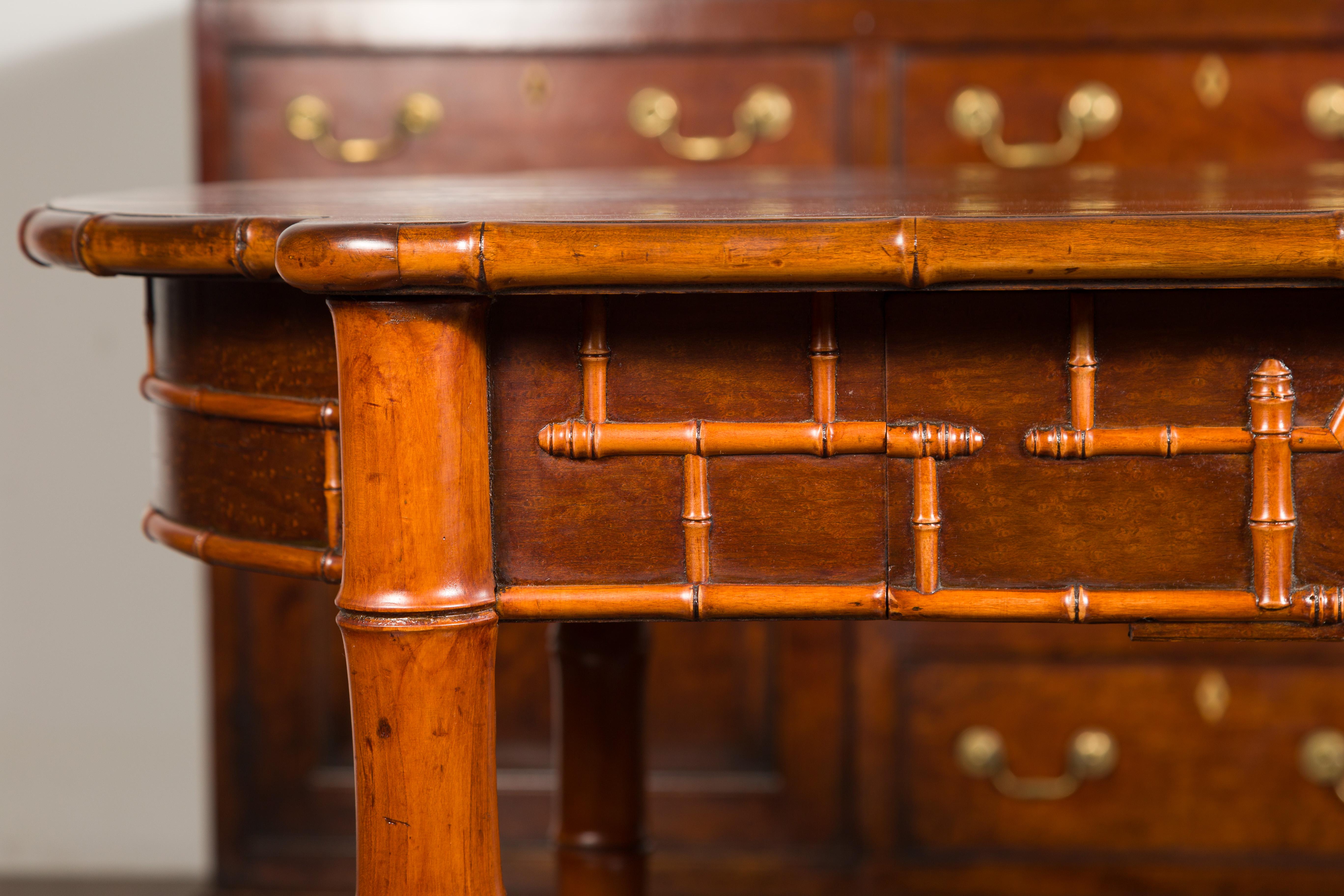 English 1870s Faux Bamboo Walnut Desk with Oval Top, Drawers and Root Style Feet For Sale 3