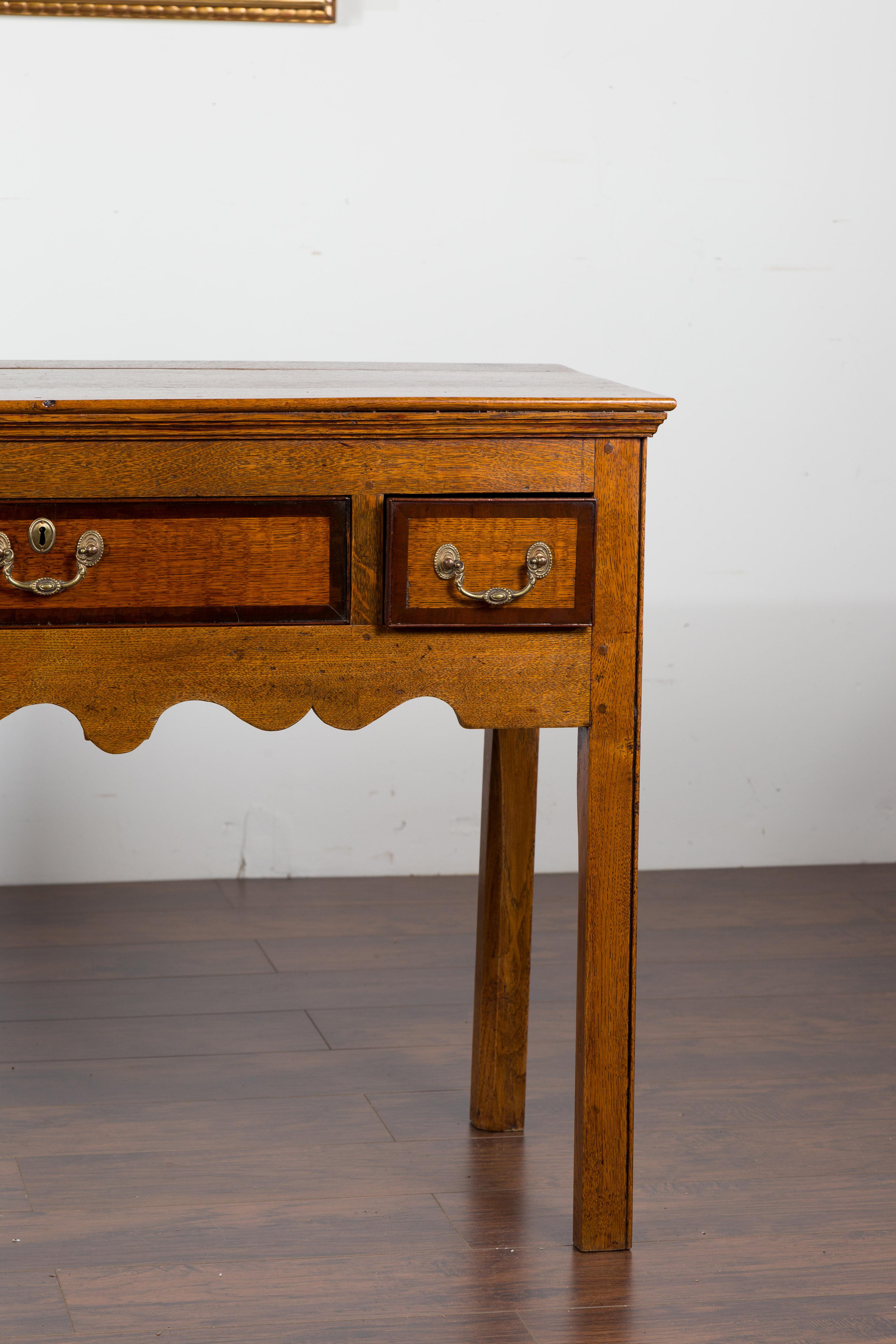 English 1870s Oak Dresser Base with Two-Toned Drawers and Scalloped Apron 2