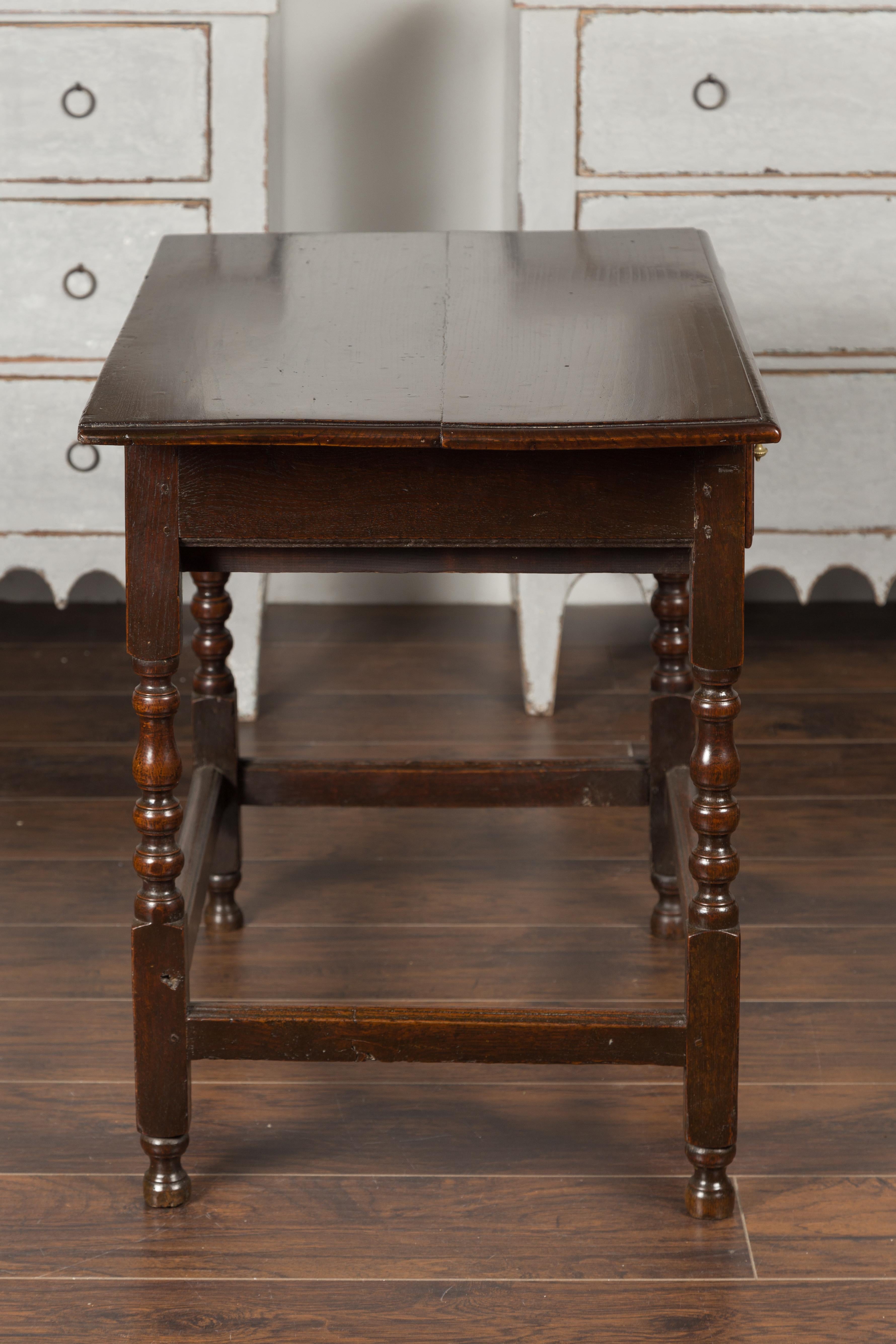 English 1870s Oak Side Table with Single Drawer, Turned Legs and Carved Apron 6