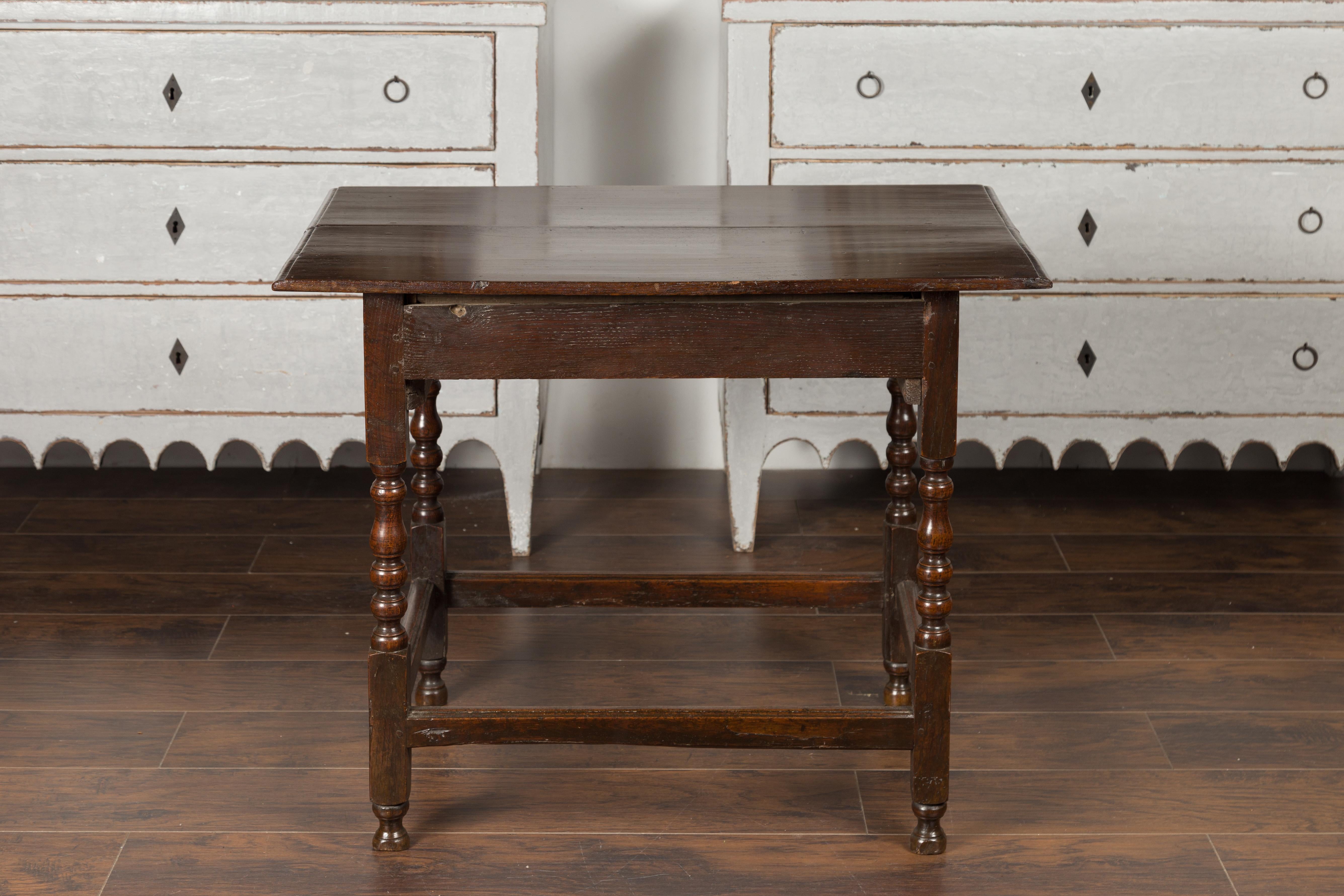 English 1870s Oak Side Table with Single Drawer, Turned Legs and Carved Apron 7