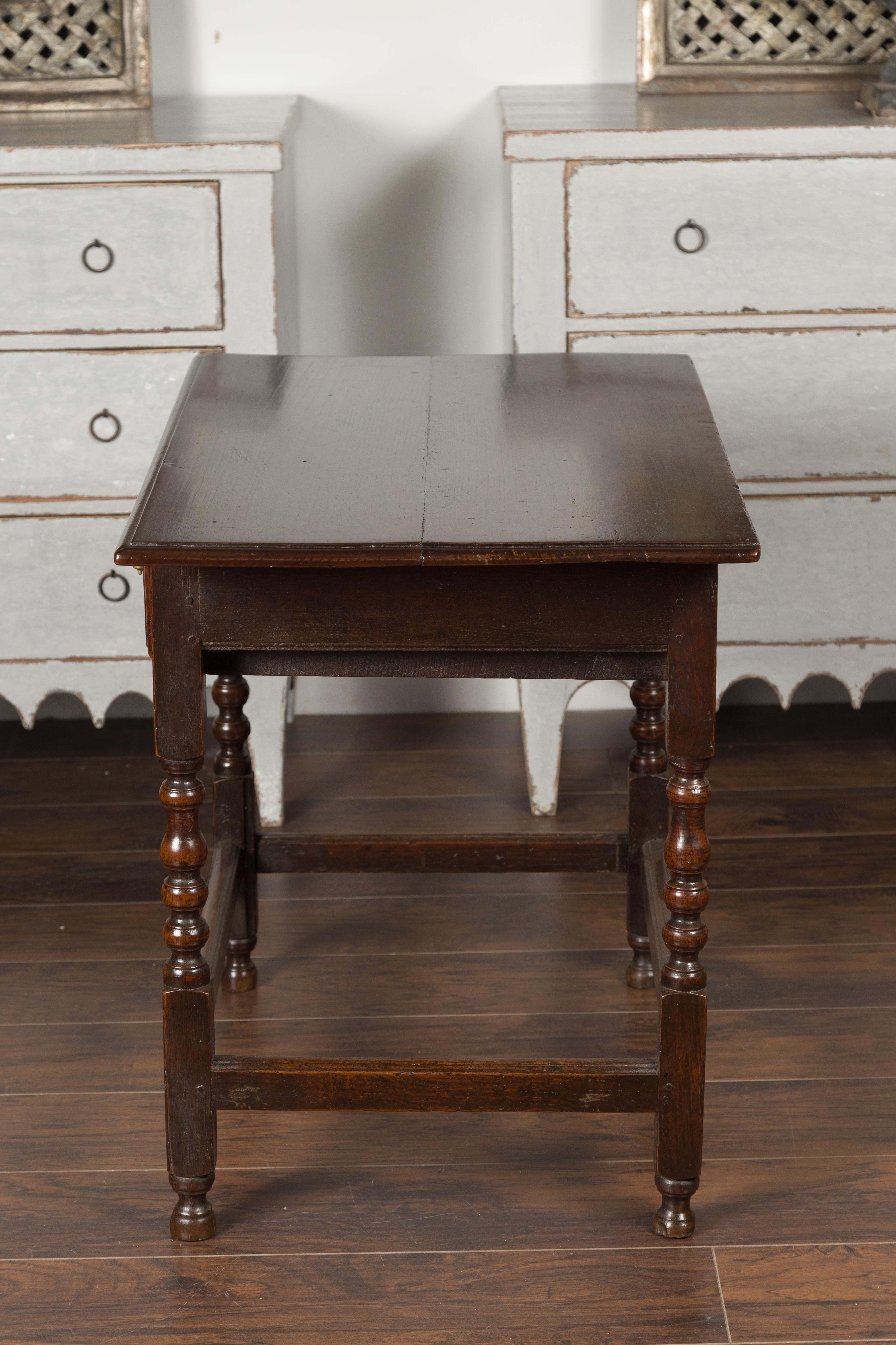 English 1870s Oak Side Table with Single Drawer, Turned Legs and Carved Apron 8