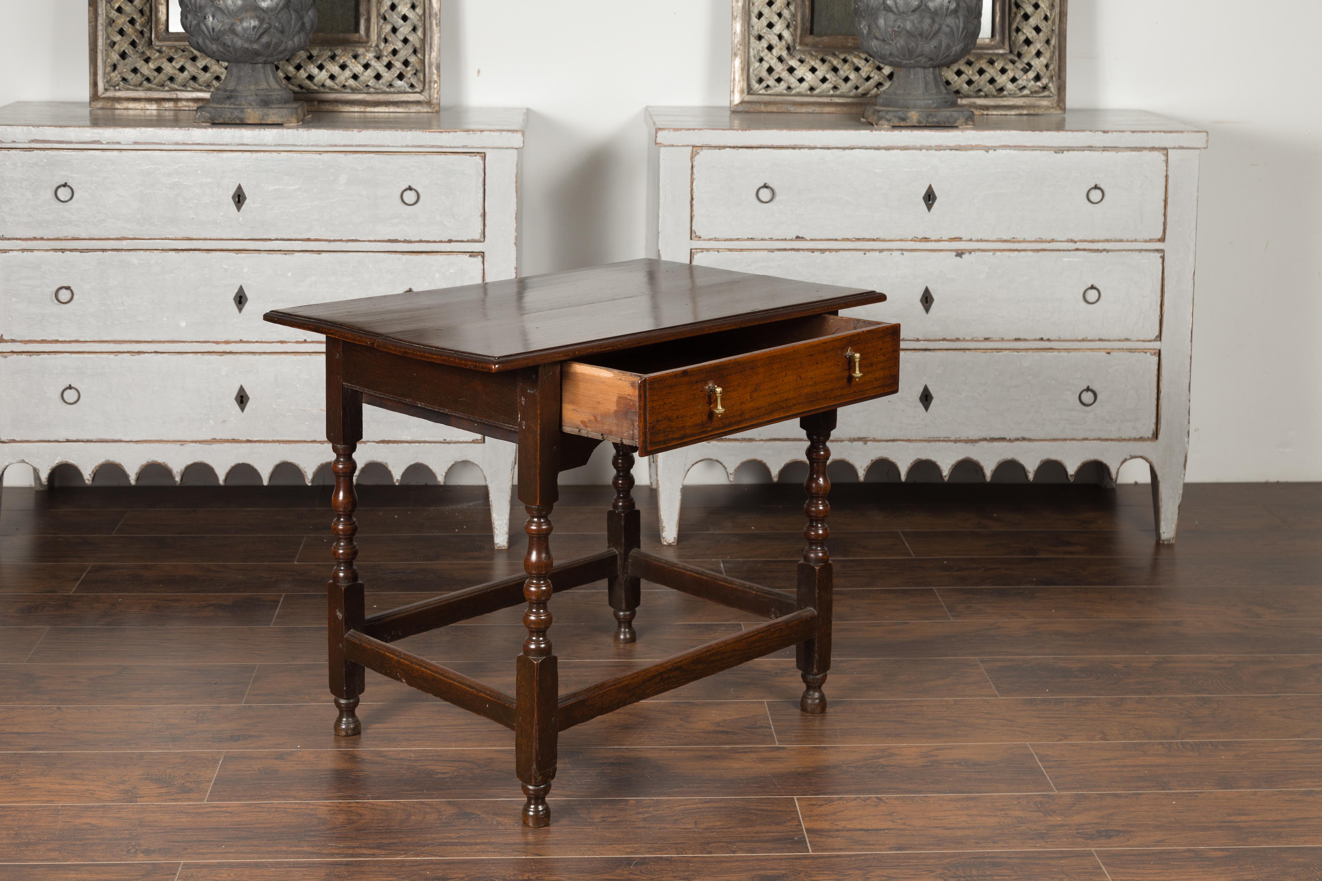 English 1870s Oak Side Table with Single Drawer, Turned Legs and Carved Apron 3