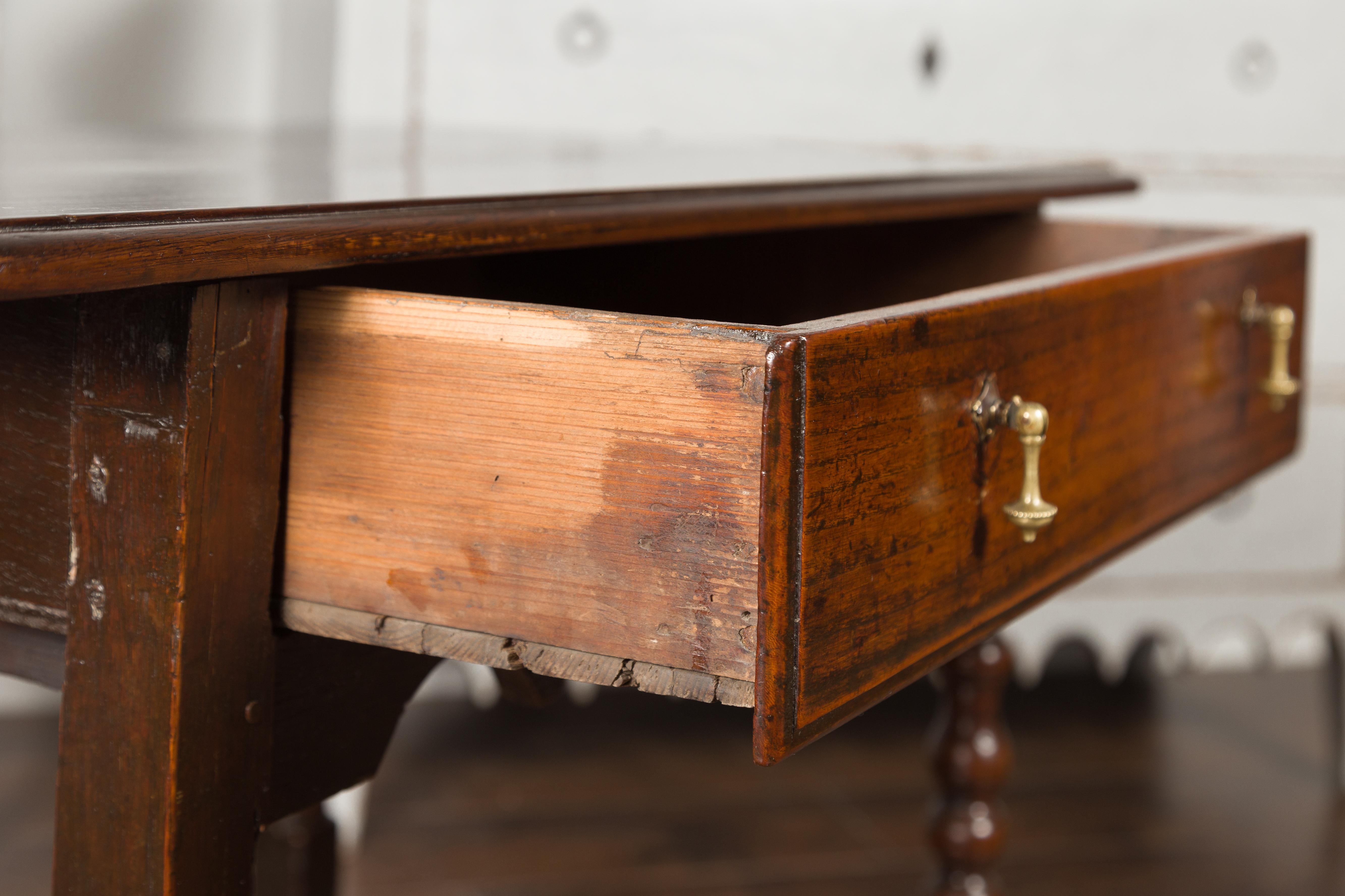 English 1870s Oak Side Table with Single Drawer, Turned Legs and Carved Apron 4