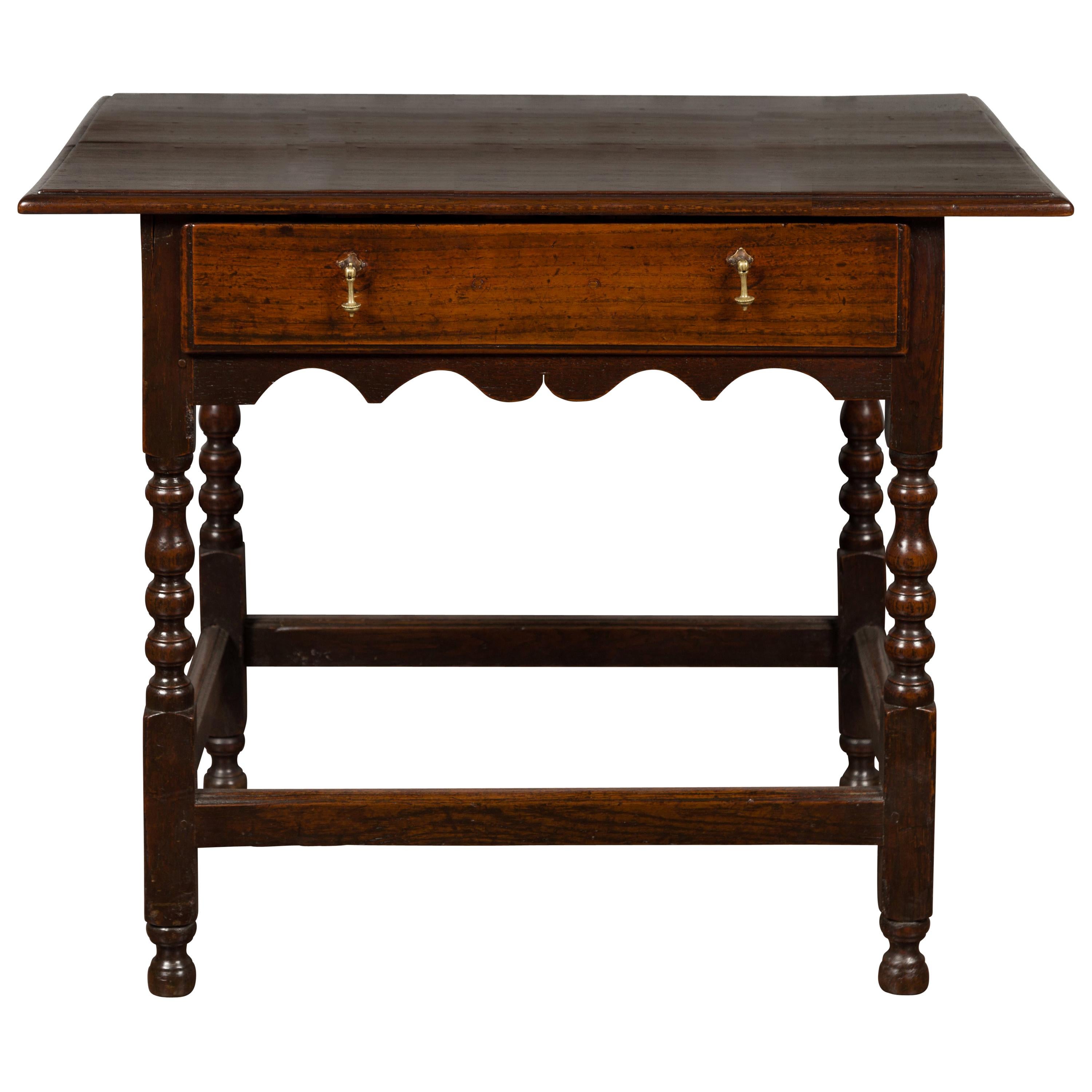 English 1870s Oak Side Table with Single Drawer, Turned Legs and Carved Apron