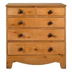 English 1870s Pine Five-Drawer Chest with Valanced Apron and Wooden Pulls