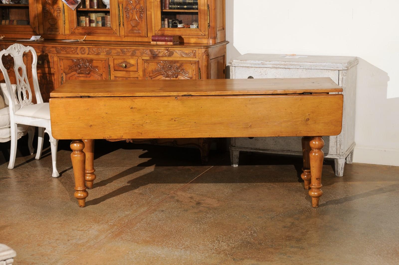 19th Century English 1875s Pine Drop Leaf Table with Two Lateral Drawers and Turned Legs For Sale