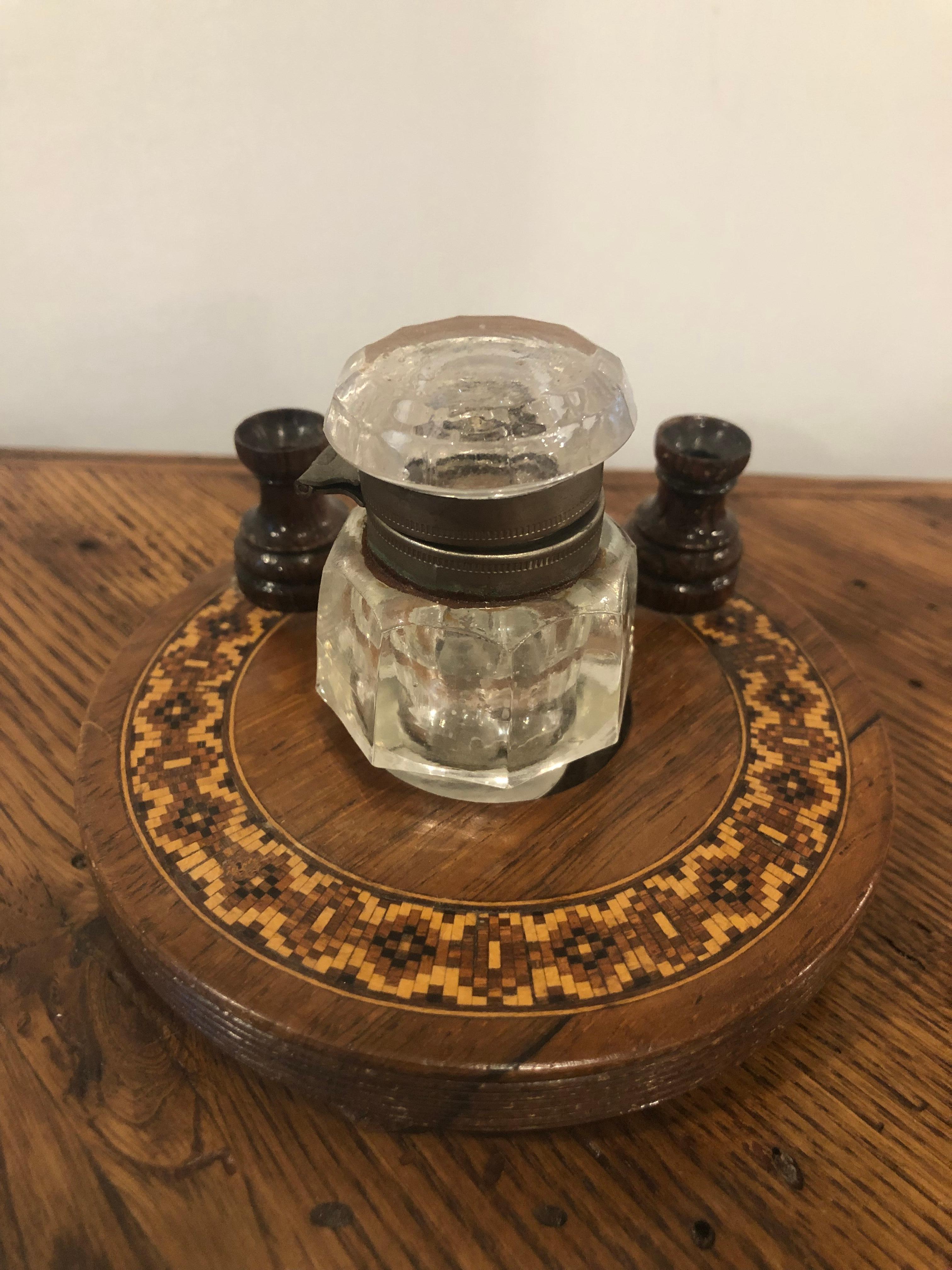 Late 19th century Tunbridge ware rosewood ink stand with bun feet and a crystal ink well. A nice combination of wood inlay and crystal. This is from a private collector who traveled the world buying beautiful pieces.