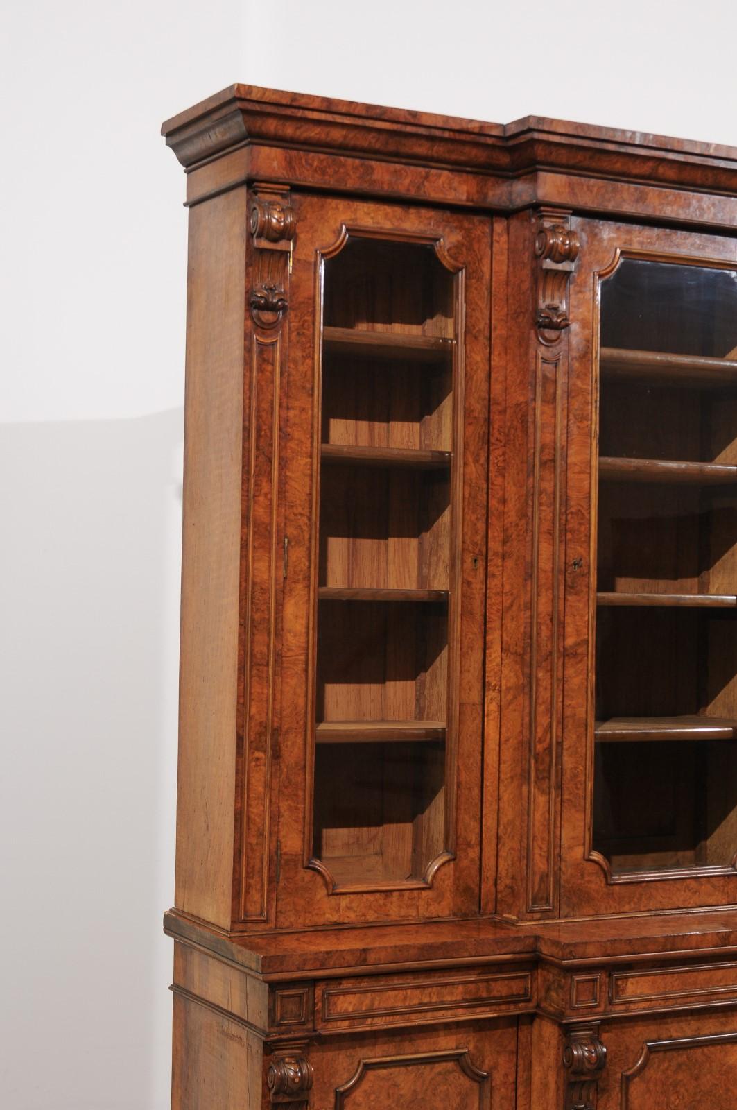 English 1880s Burled Walnut Breakfront Bookcase with Glass Doors and Volutes 2