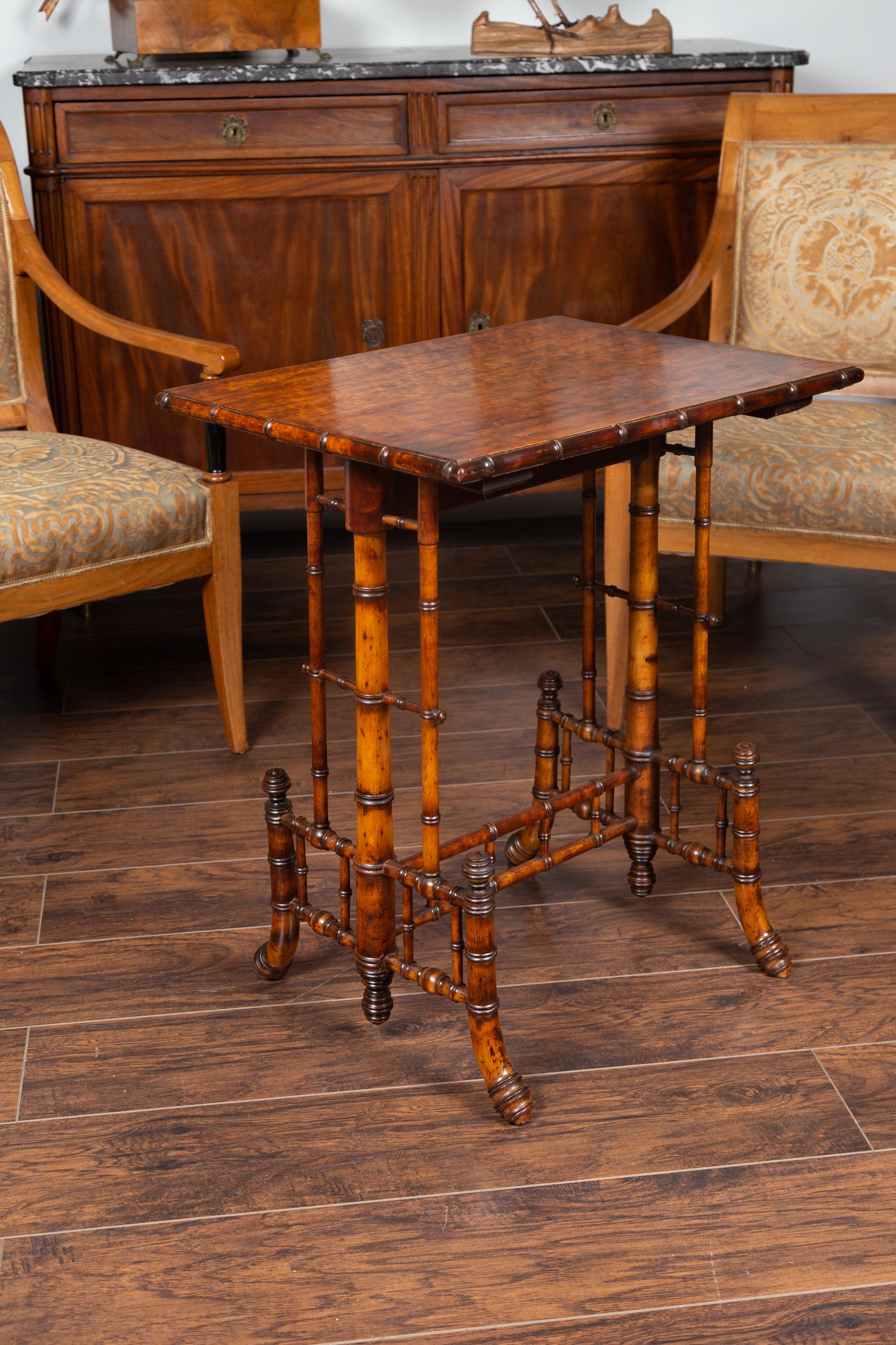 An English walnut Chinese Chippendale style faux bamboo side table from the late 19th century. Born in England during the last quarter of the 19th century, this side table presents an exquisite Chinese Chippendale style appearance. The rectangular