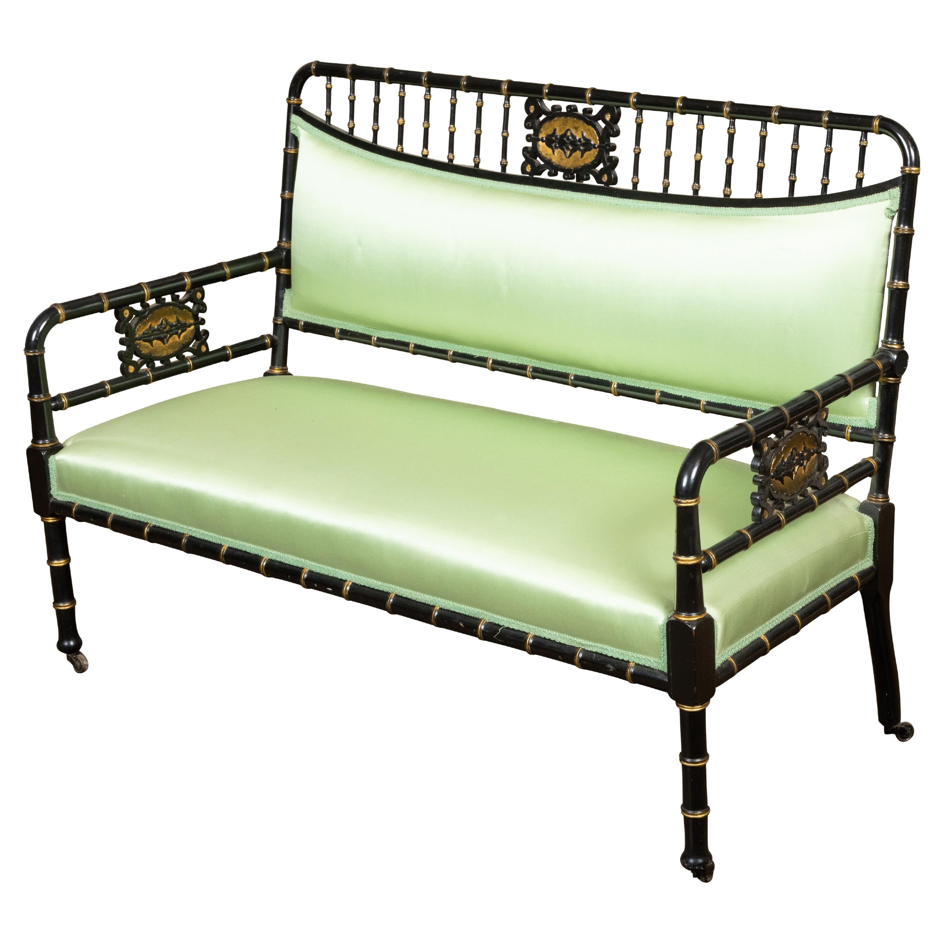 English 1880s Ebonized Faux Bamboo Bench with Gilt Accents and Green Upholstery