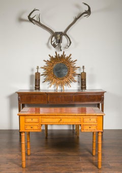 English 1880s Faux-Bamboo Desk with Copper Hued Leather Top and Five Drawers