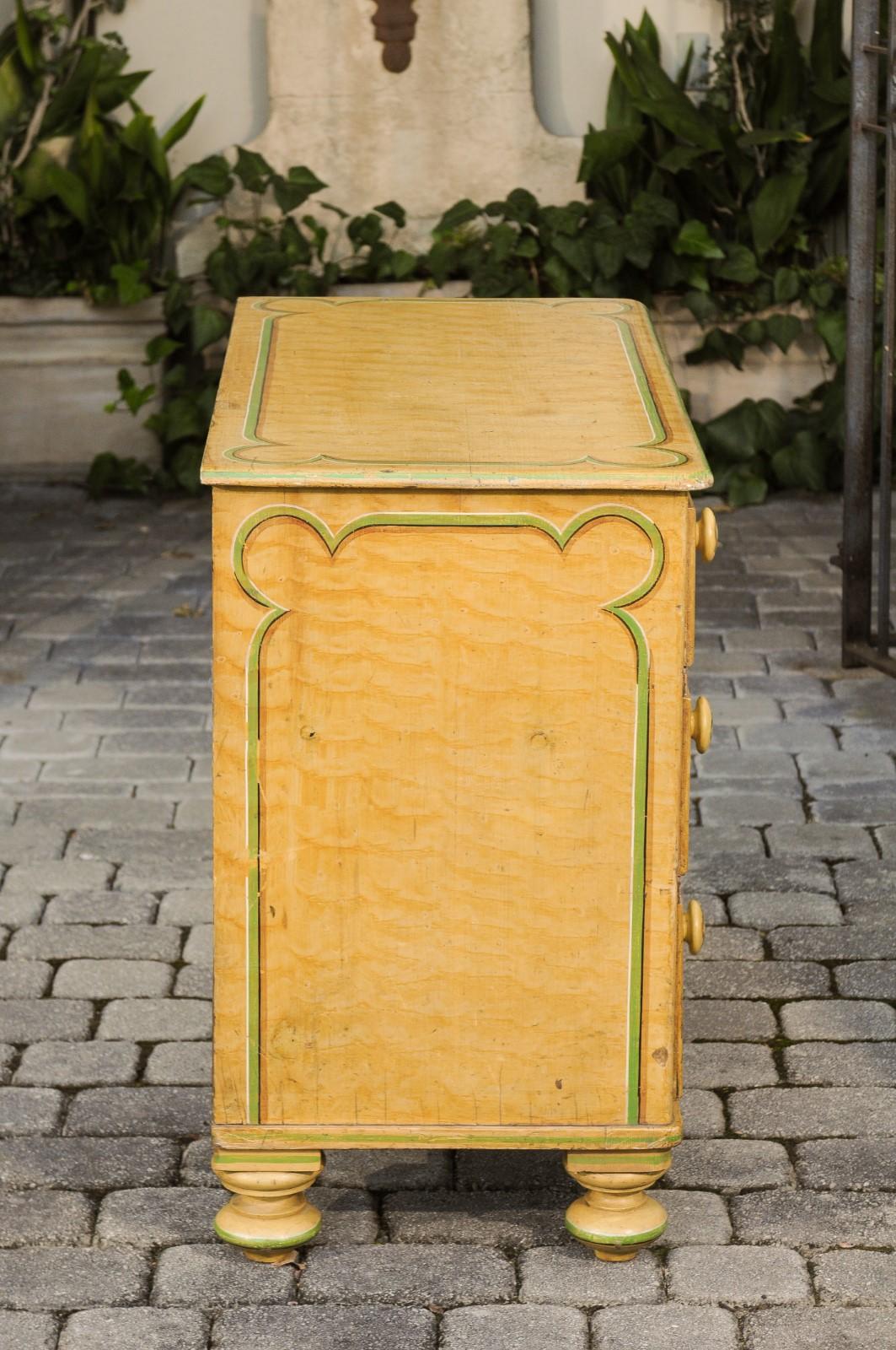 English 1880s Four-Drawer Goldenrod Chest with Green Painted Cartouche Motifs 2