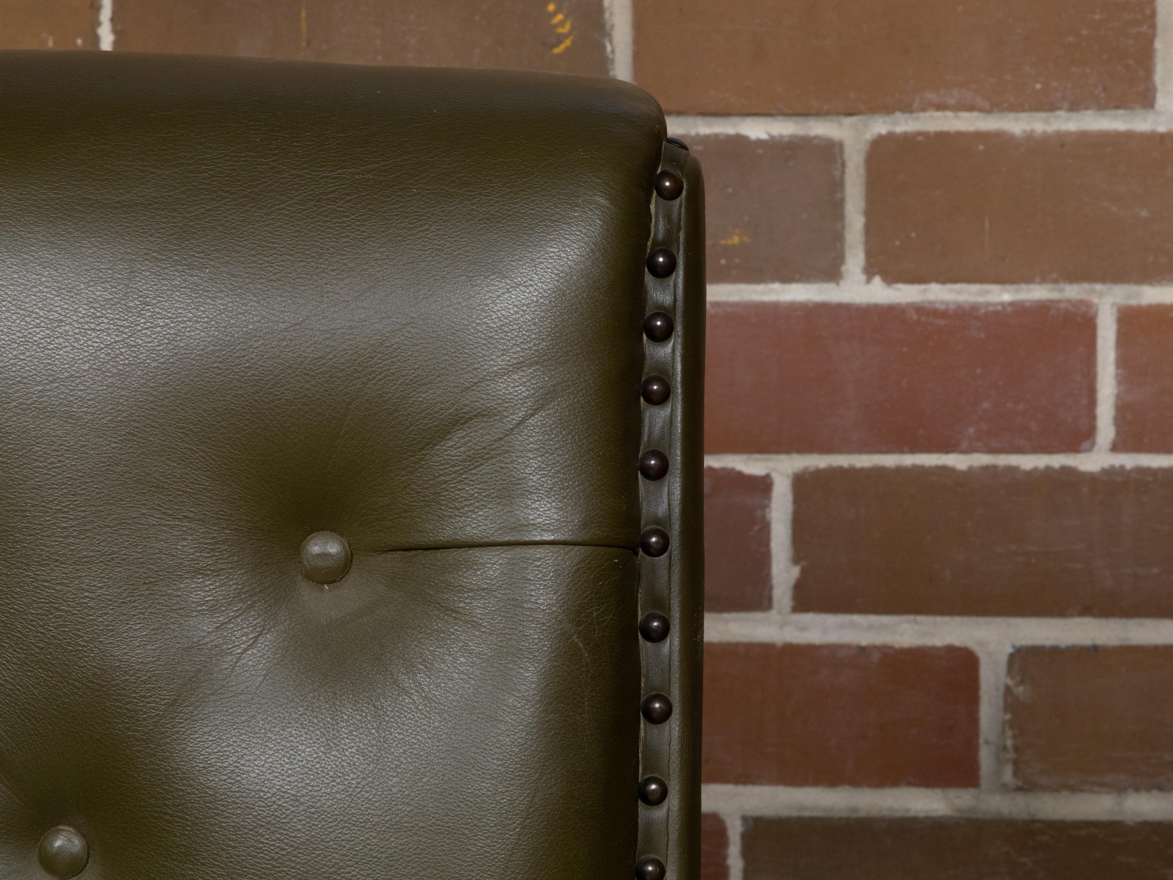 English 1880s Green Tufted Leather Armchair with Turned Legs on Casters For Sale 7