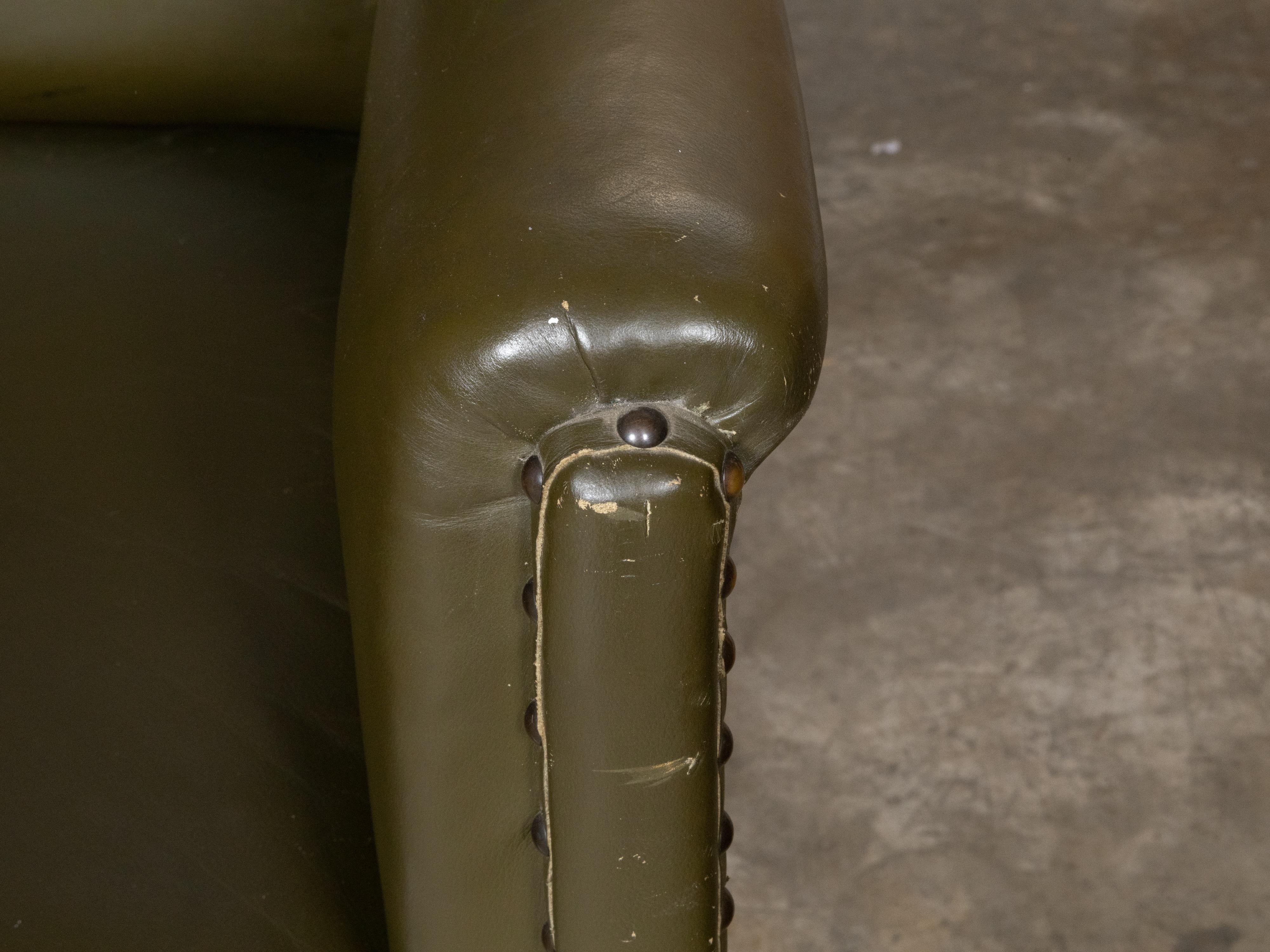 English 1880s Green Tufted Leather Armchair with Turned Legs on Casters For Sale 8