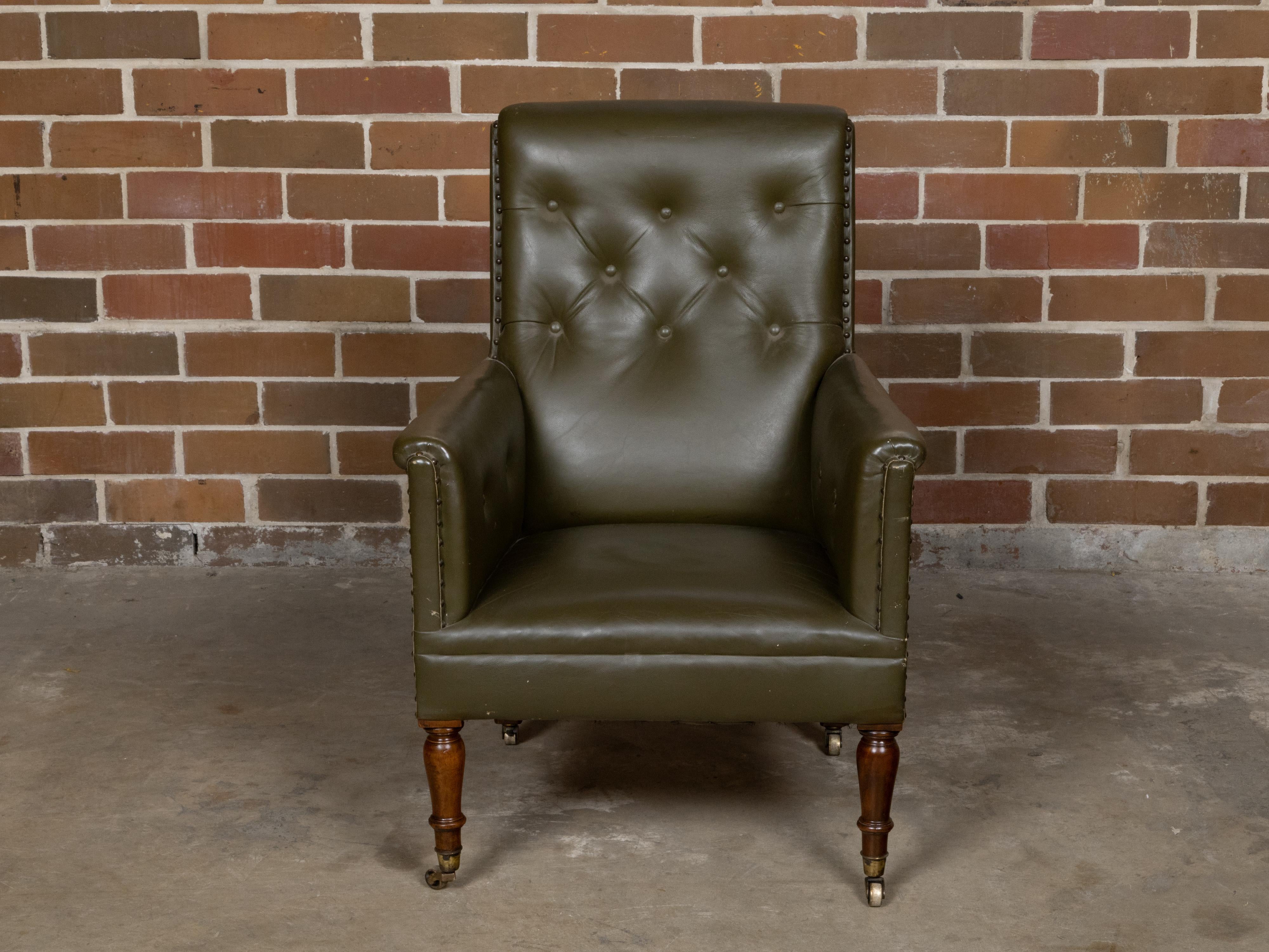 English 1880s Green Tufted Leather Armchair with Turned Legs on Casters In Good Condition For Sale In Atlanta, GA