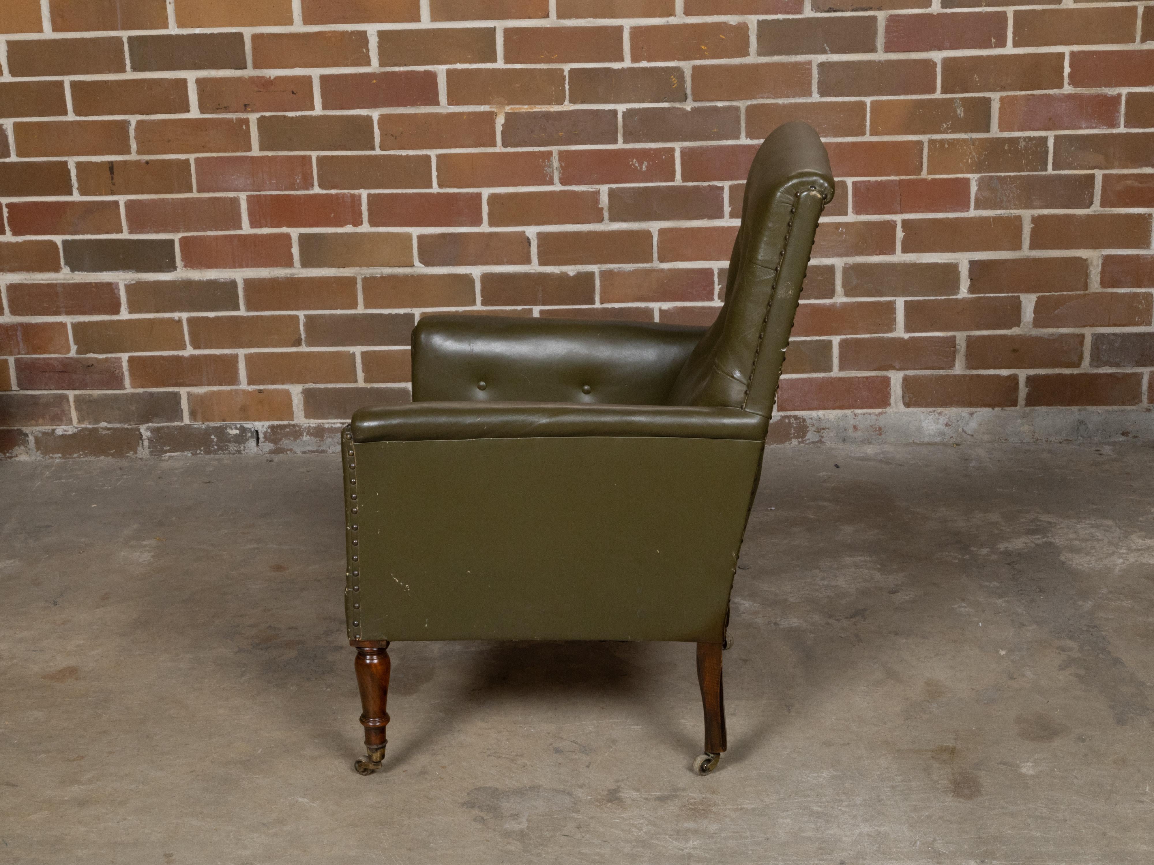 19th Century English 1880s Green Tufted Leather Armchair with Turned Legs on Casters For Sale