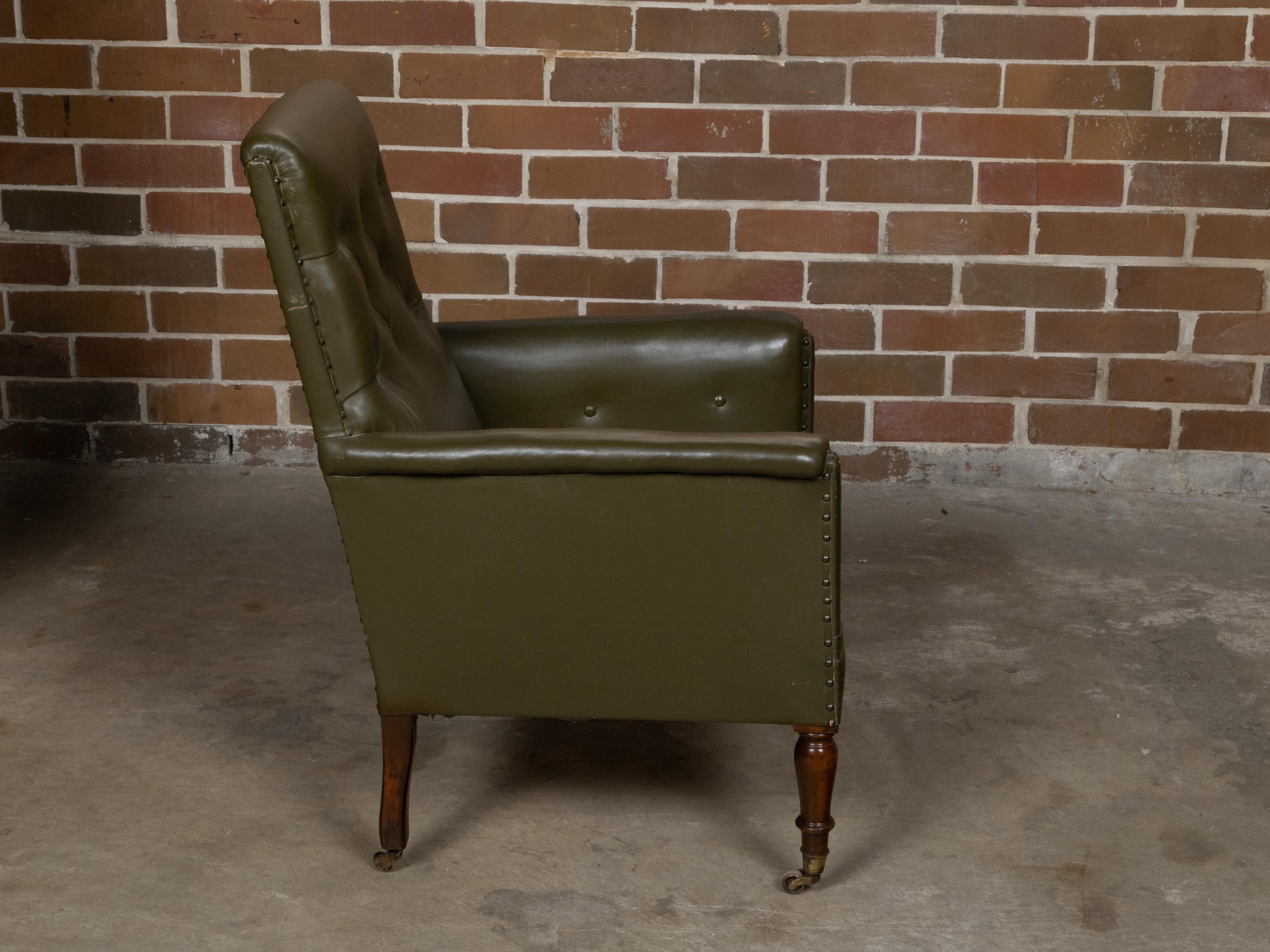 English 1880s Green Tufted Leather Armchair with Turned Legs on Casters For Sale 2