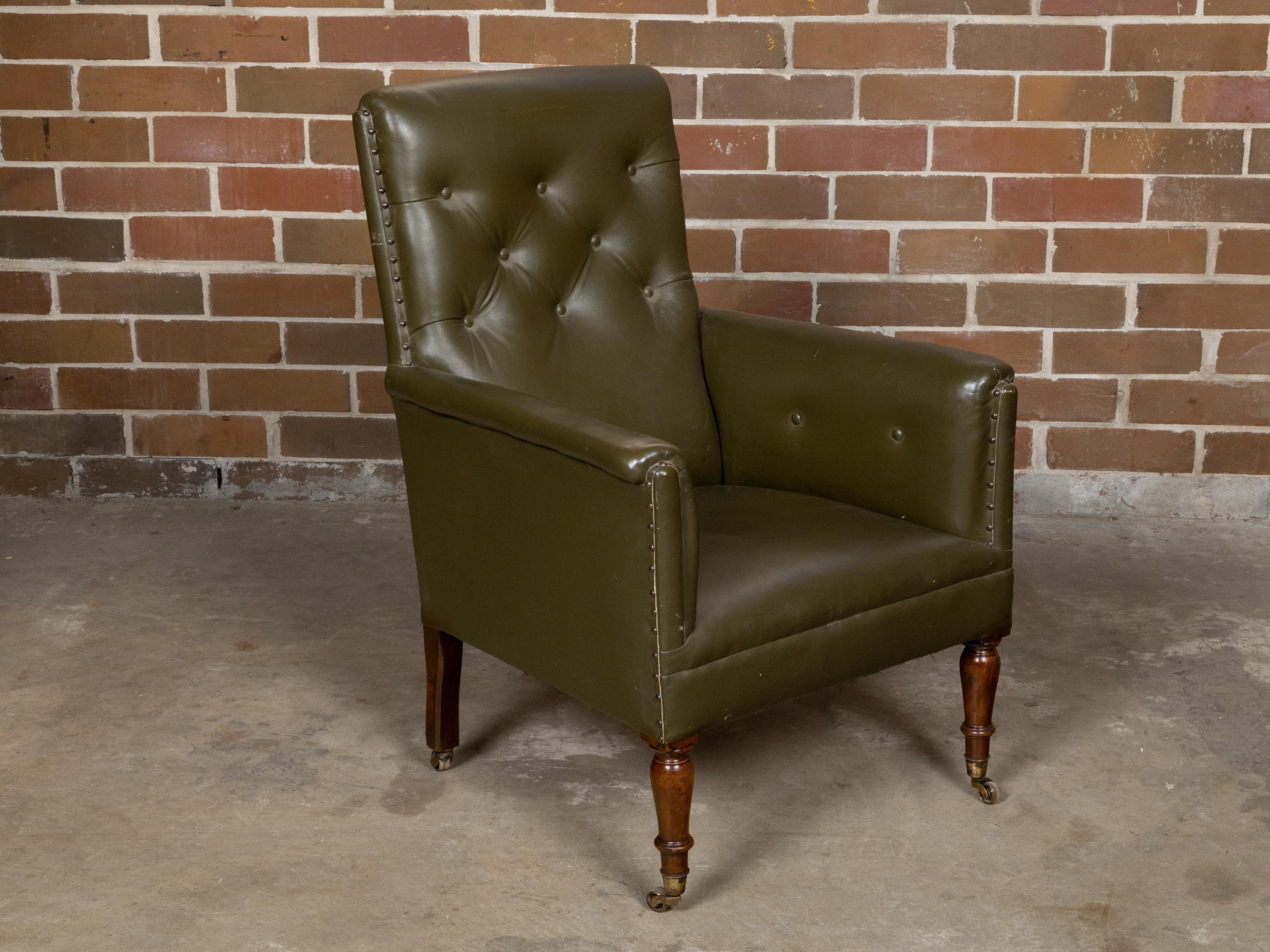 English 1880s Green Tufted Leather Armchair with Turned Legs on Casters For Sale 3
