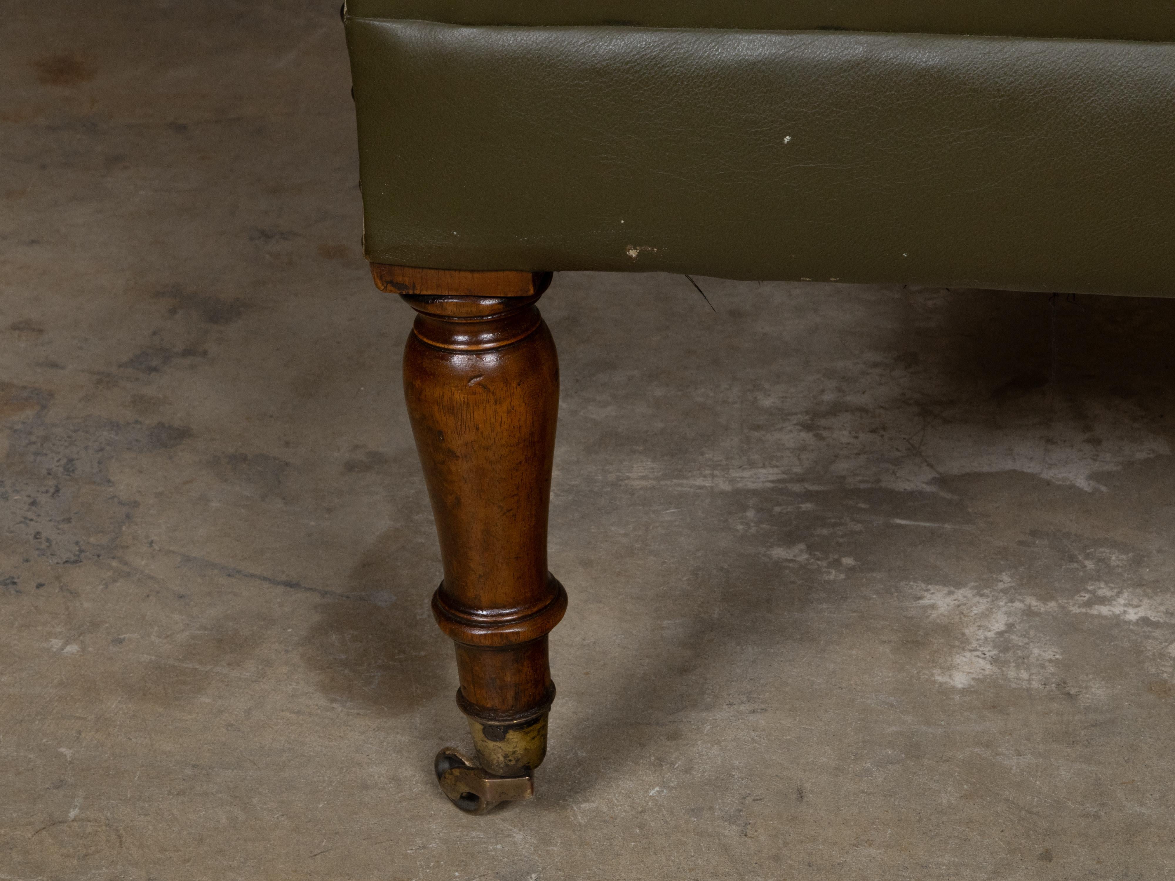 English 1880s Green Tufted Leather Armchair with Turned Legs on Casters For Sale 4