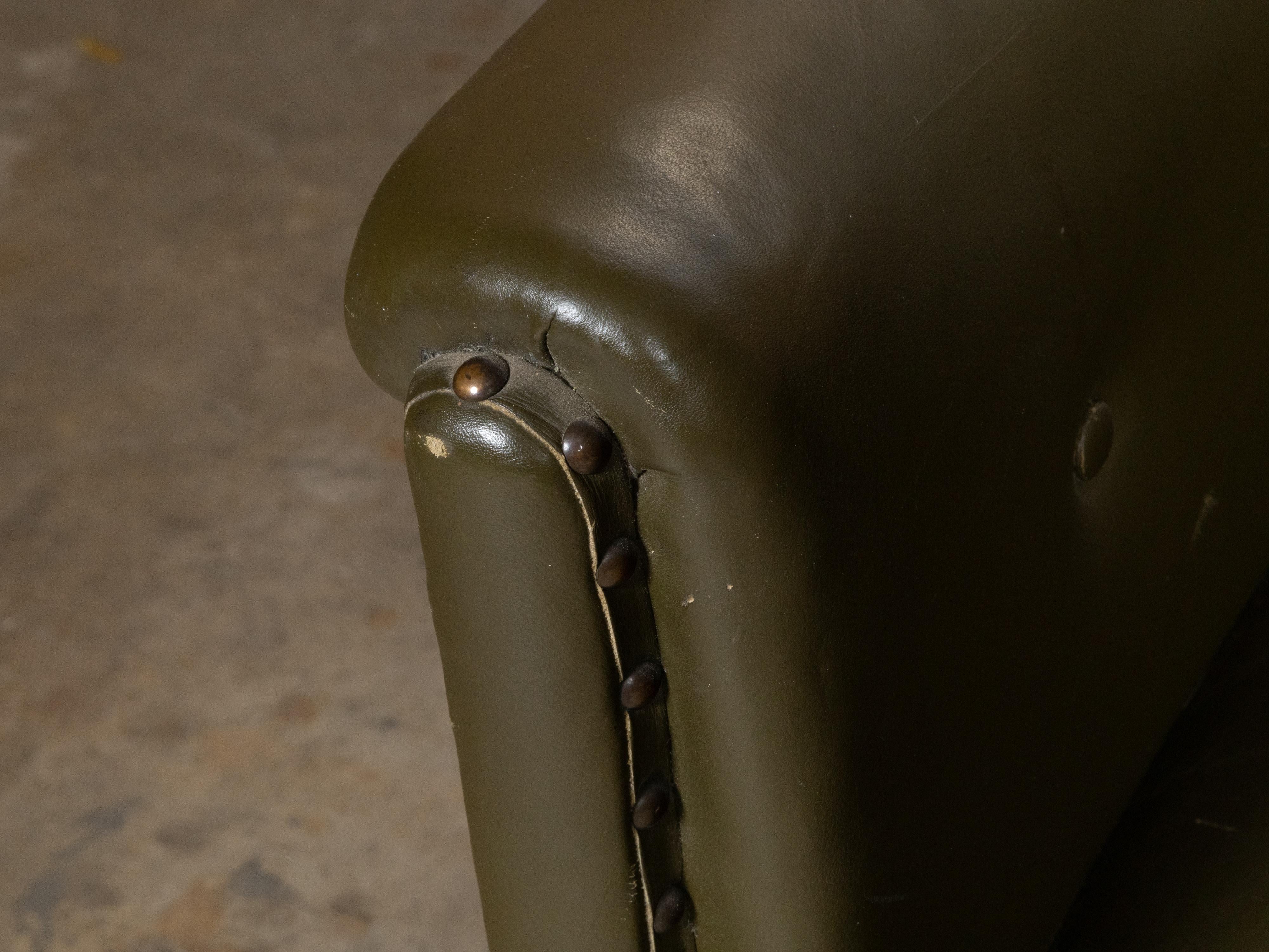 English 1880s Green Tufted Leather Armchair with Turned Legs on Casters For Sale 5