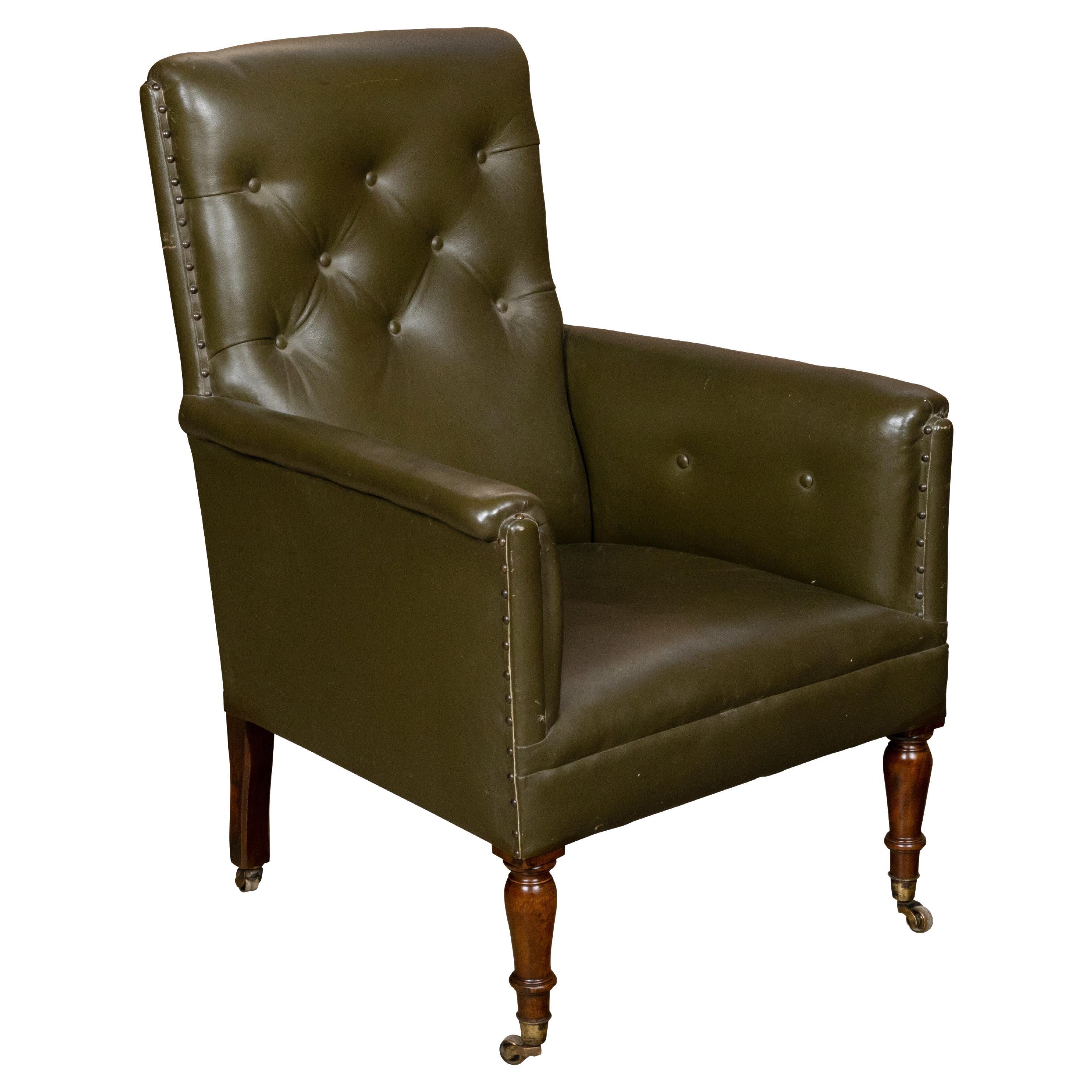 English 1880s Green Tufted Leather Armchair with Turned Legs on Casters For Sale