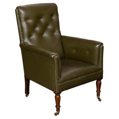 English 1880s Green Tufted Leather Armchair with Turned Legs on Casters