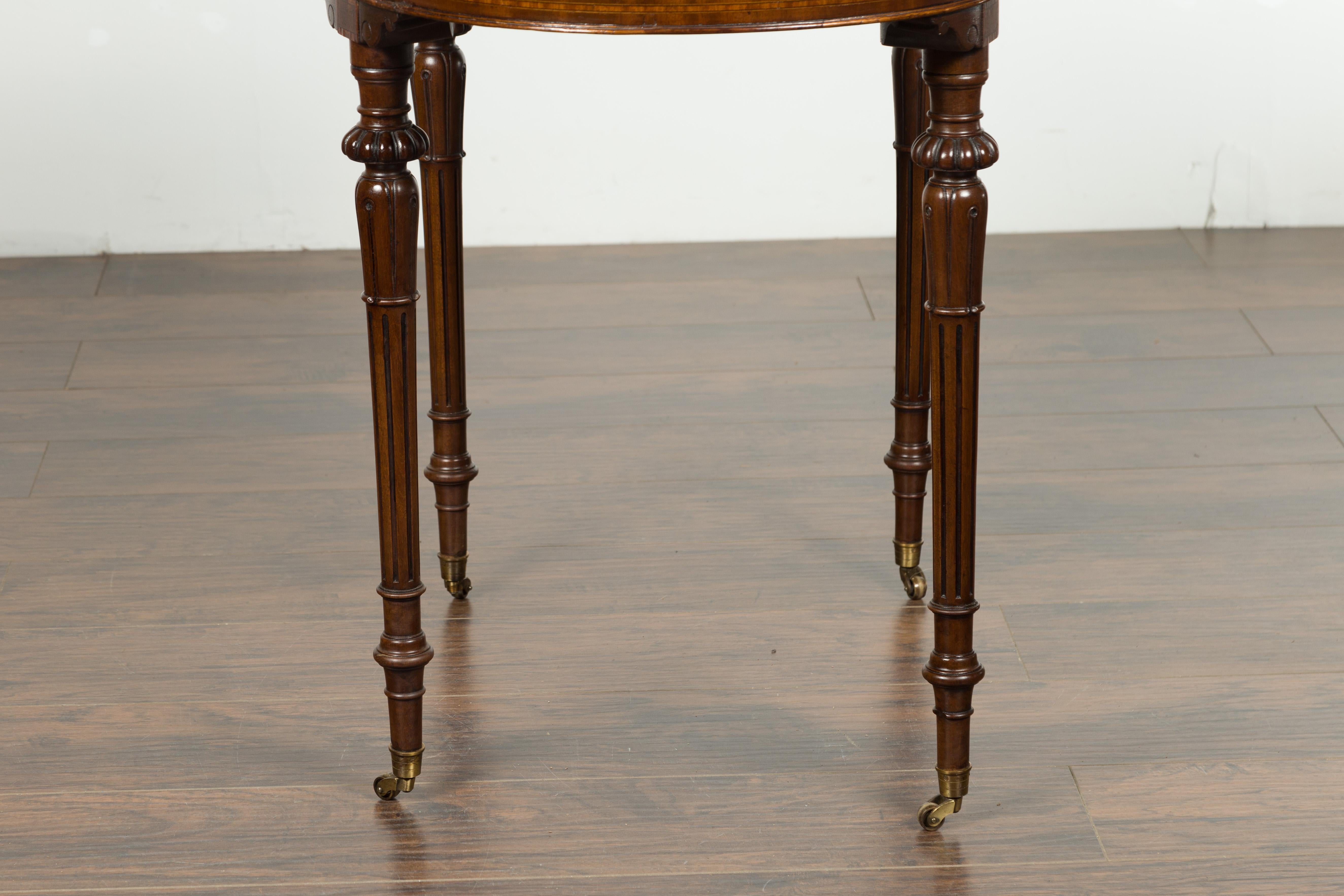 English 1880s Mahogany Kidney Table with Leather Top, Banding and Casters 12