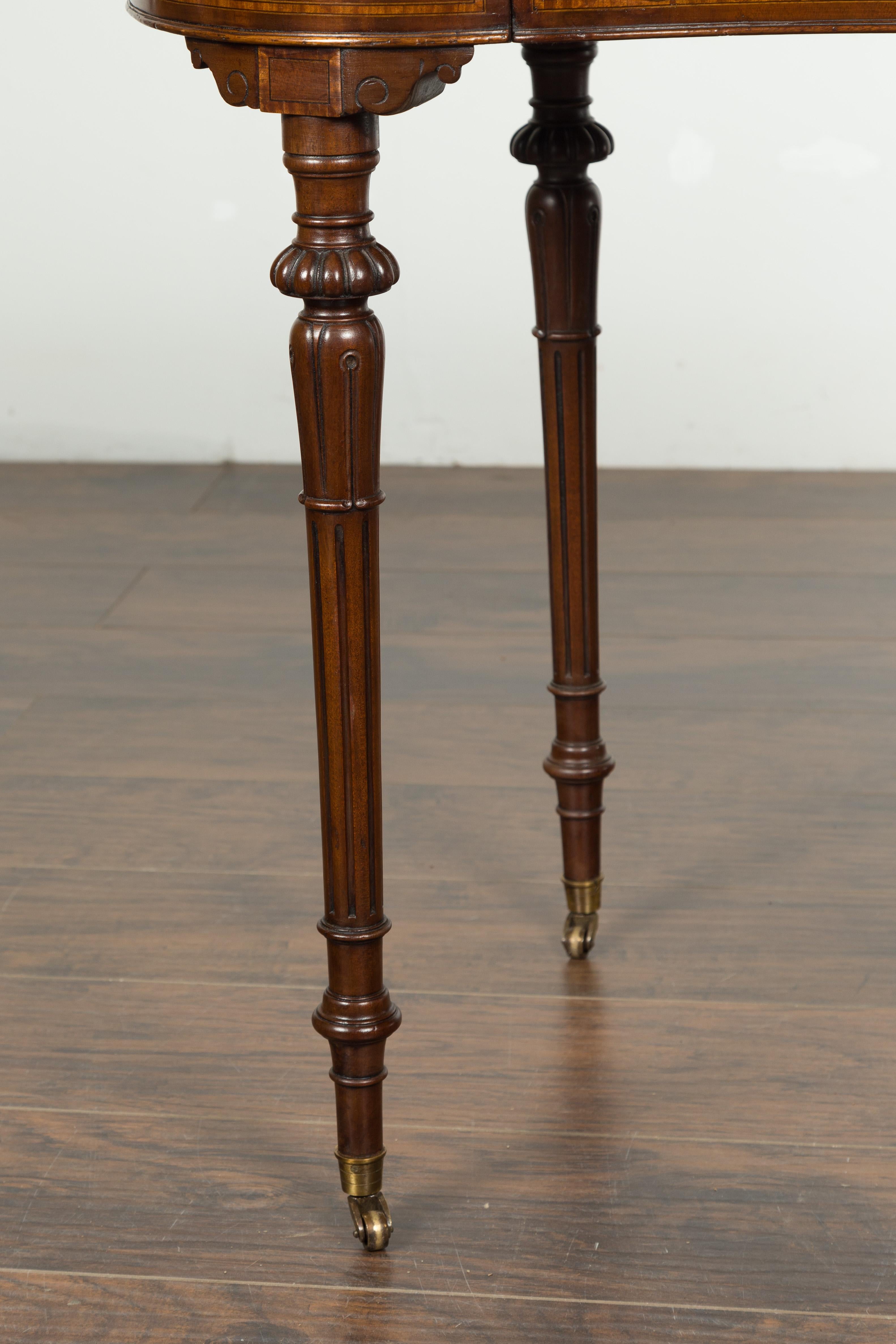 English 1880s Mahogany Kidney Table with Leather Top, Banding and Casters 4