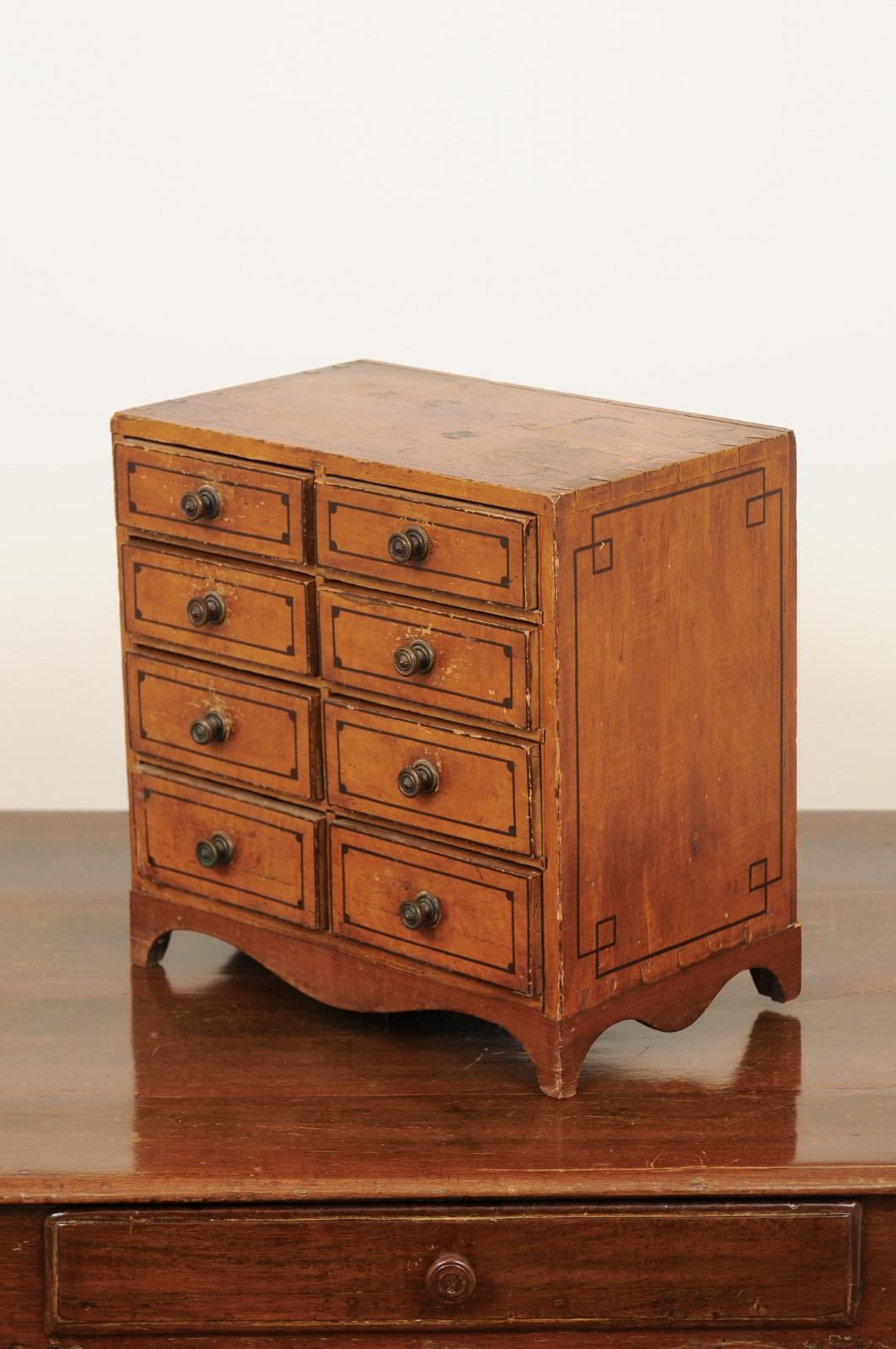 English 1880s Miniature Tabletop Chest with Eight Drawers and Valanced Skirt 4