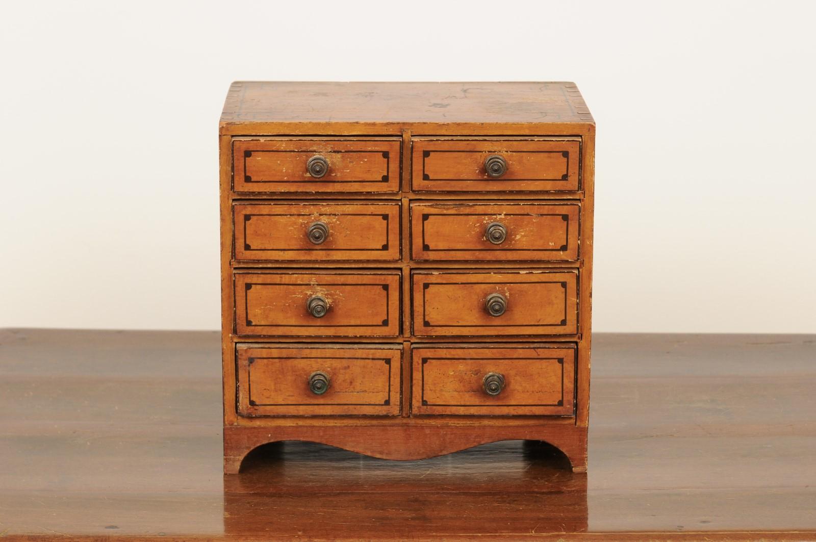 English 1880s Miniature Tabletop Chest with Eight Drawers and Valanced Skirt 5