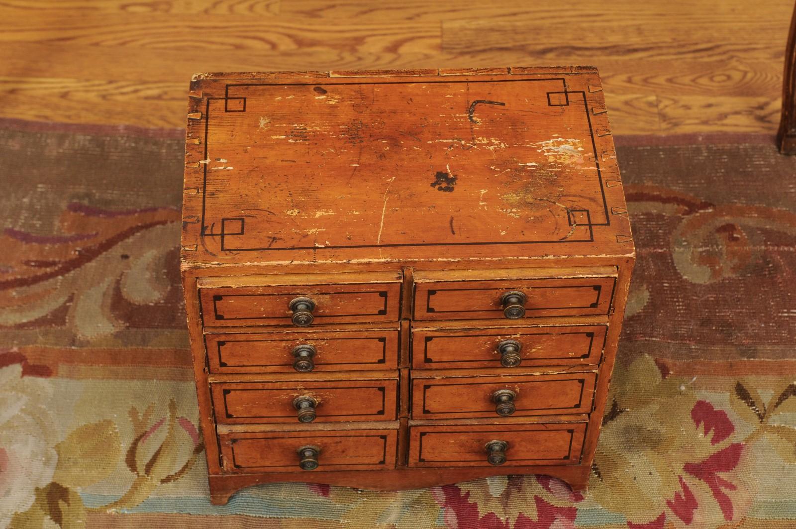 English 1880s Miniature Tabletop Chest with Eight Drawers and Valanced Skirt 8