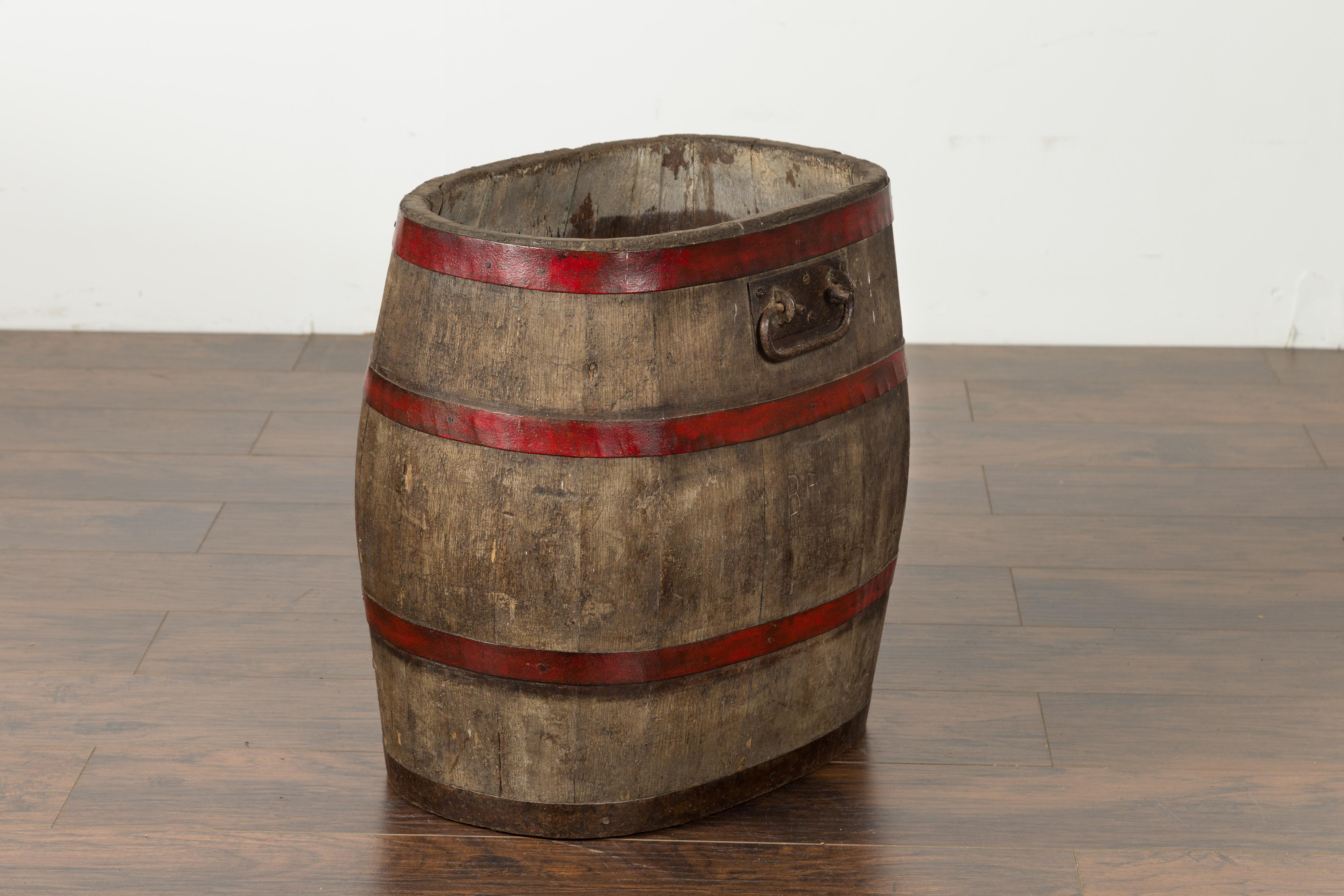English 1880s Oak Barrel with Red Braces and Weathered Patina For Sale 1