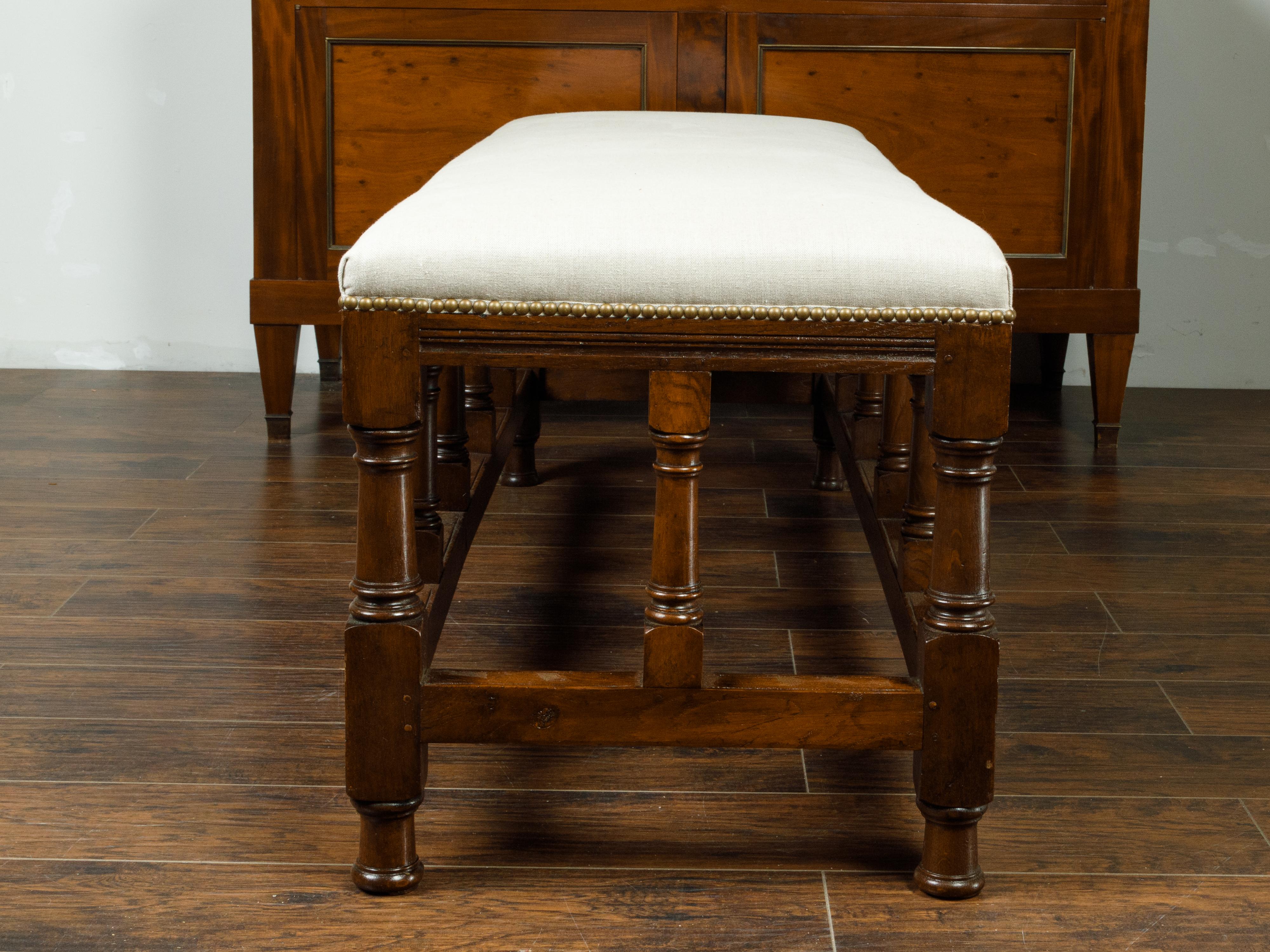 English 1880s Oak Bench with Turned Legs, Side Stretchers and New Upholstery 1